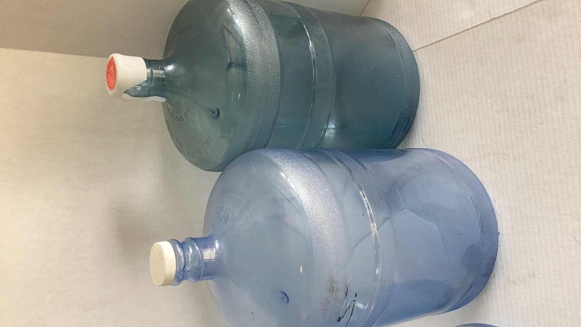 Photo 3 of THREE PLASTIC WATER BOTTLES