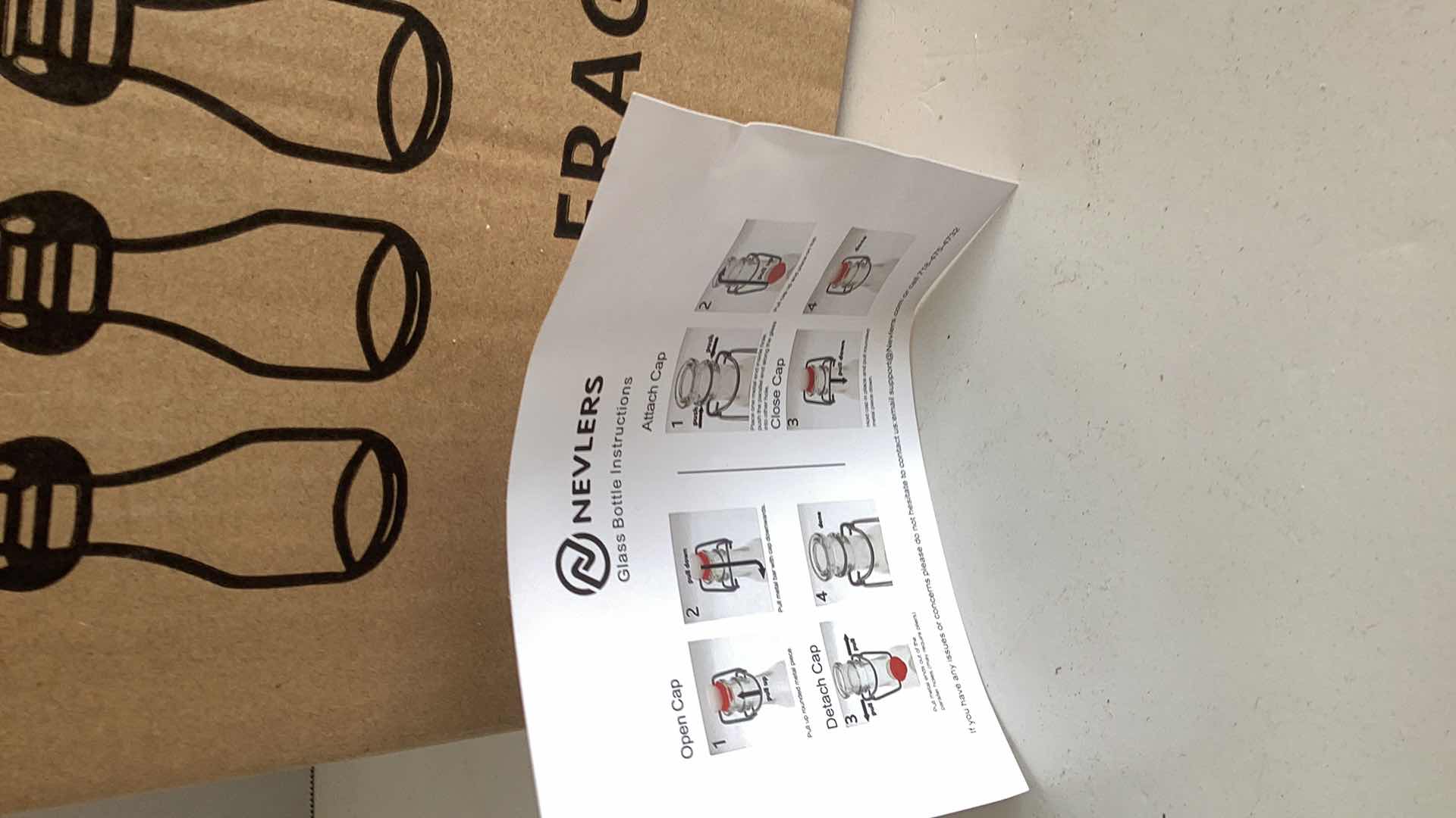 Photo 1 of BOX OF SIX NEVLERS GLASS BOTTLES