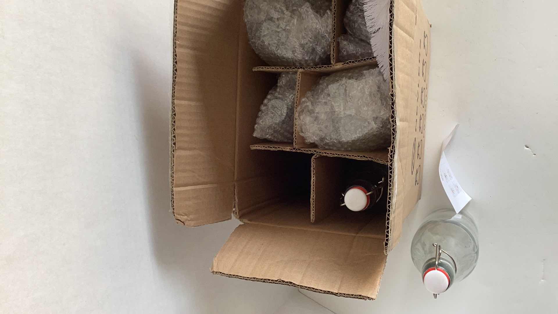 Photo 1 of BOX OF SIX NEVLERS GLASS BOTTLES