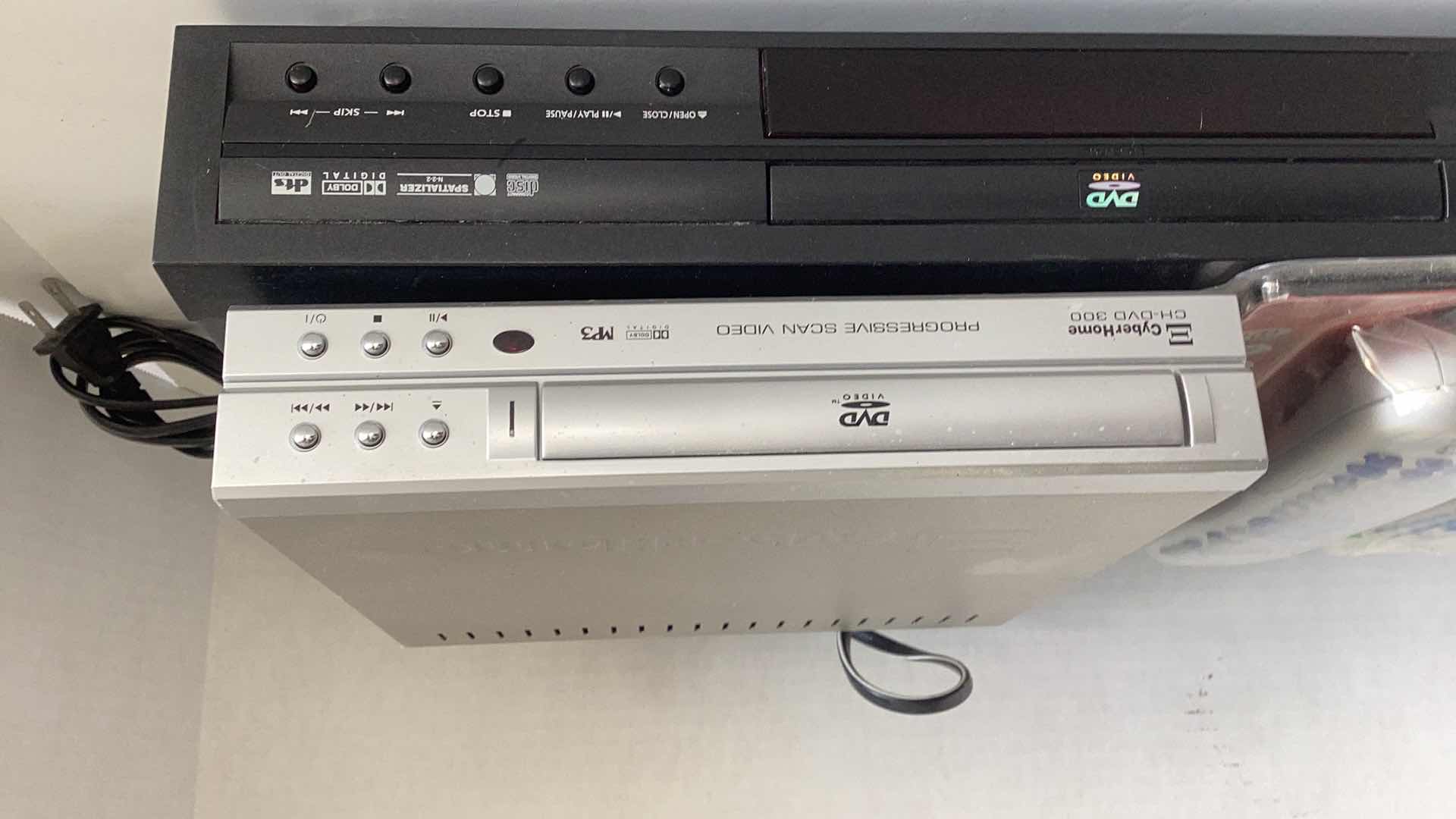 Photo 1 of TWO DVD PLAYERS AND TWO UNIVERSAL T.V. REMOTES