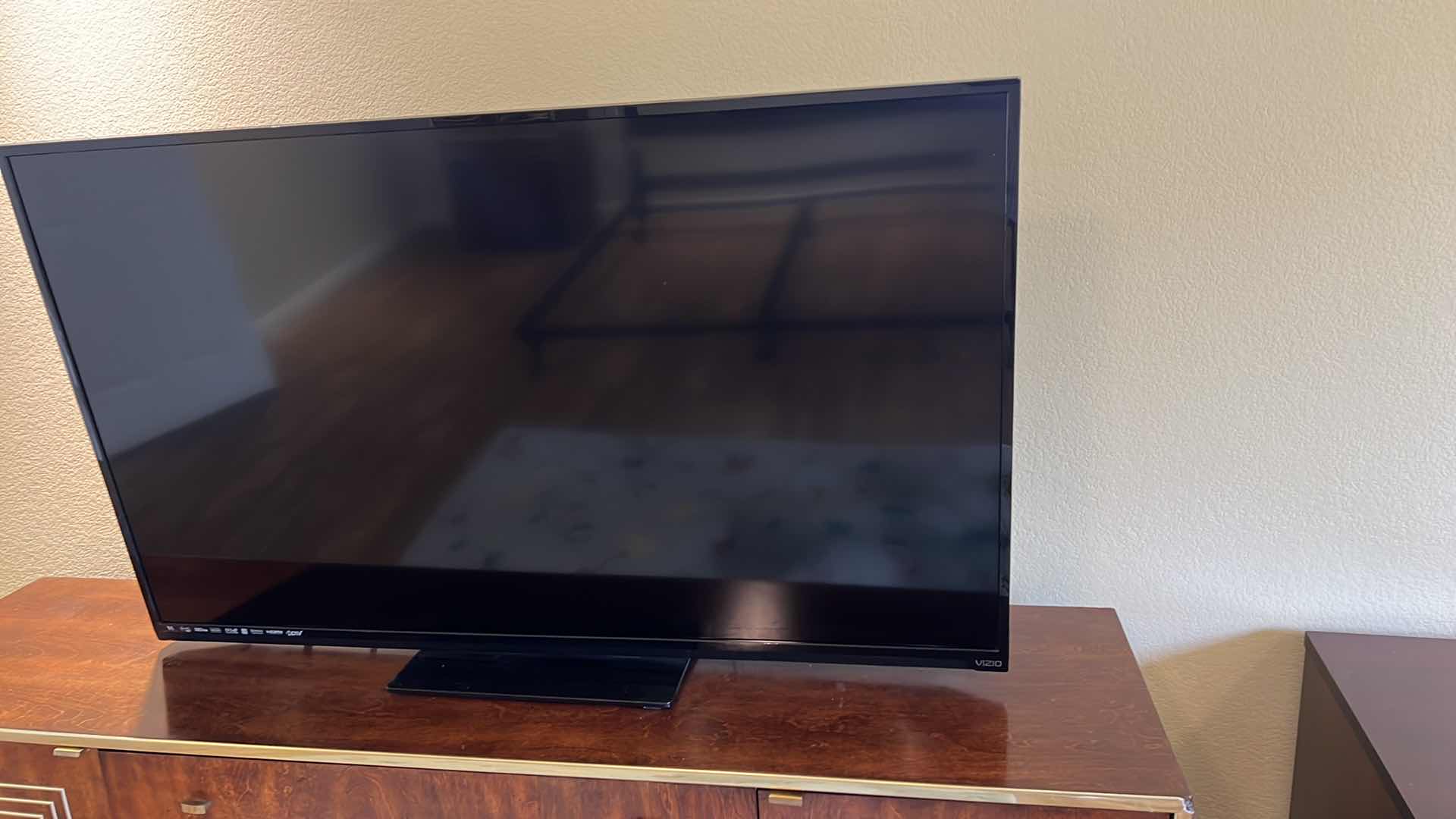 Photo 1 of 54” VIZIO TV W REMOTE ON SWIVEL STAND