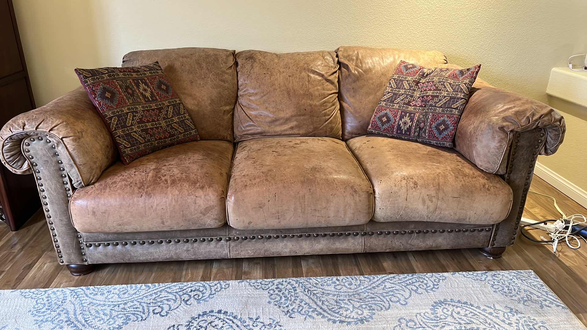 Photo 1 of 6’ TAN DISTRESSED LEATHER SOFA W NAILHEADS STUDDED TRIM (SEE PICTURES FOR WEAR)