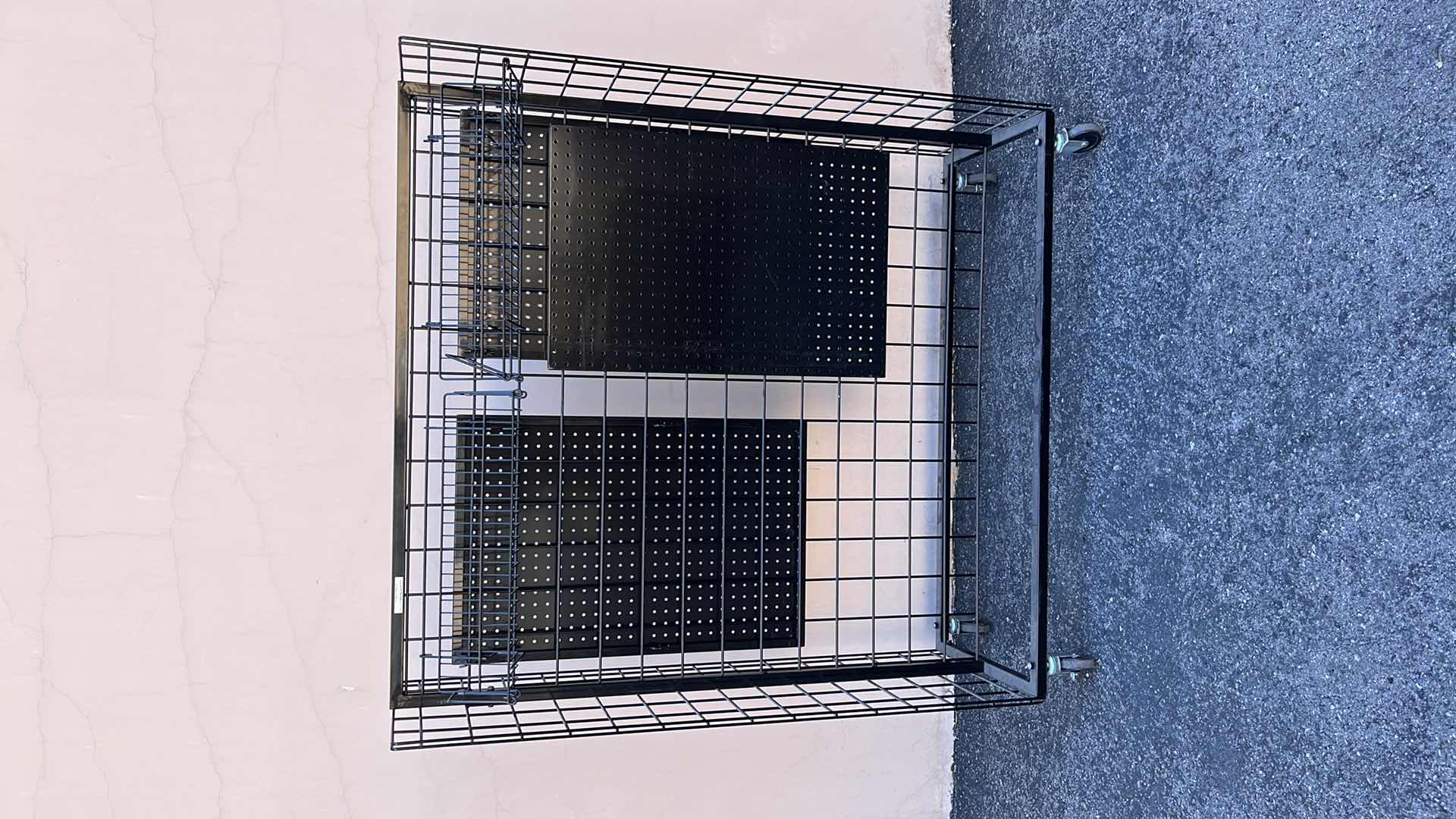 Photo 1 of DOUBLE SIDE MERCHANDISE RACK ON WHEELS 18” X 50.25” H56.5”, BLACK (1)