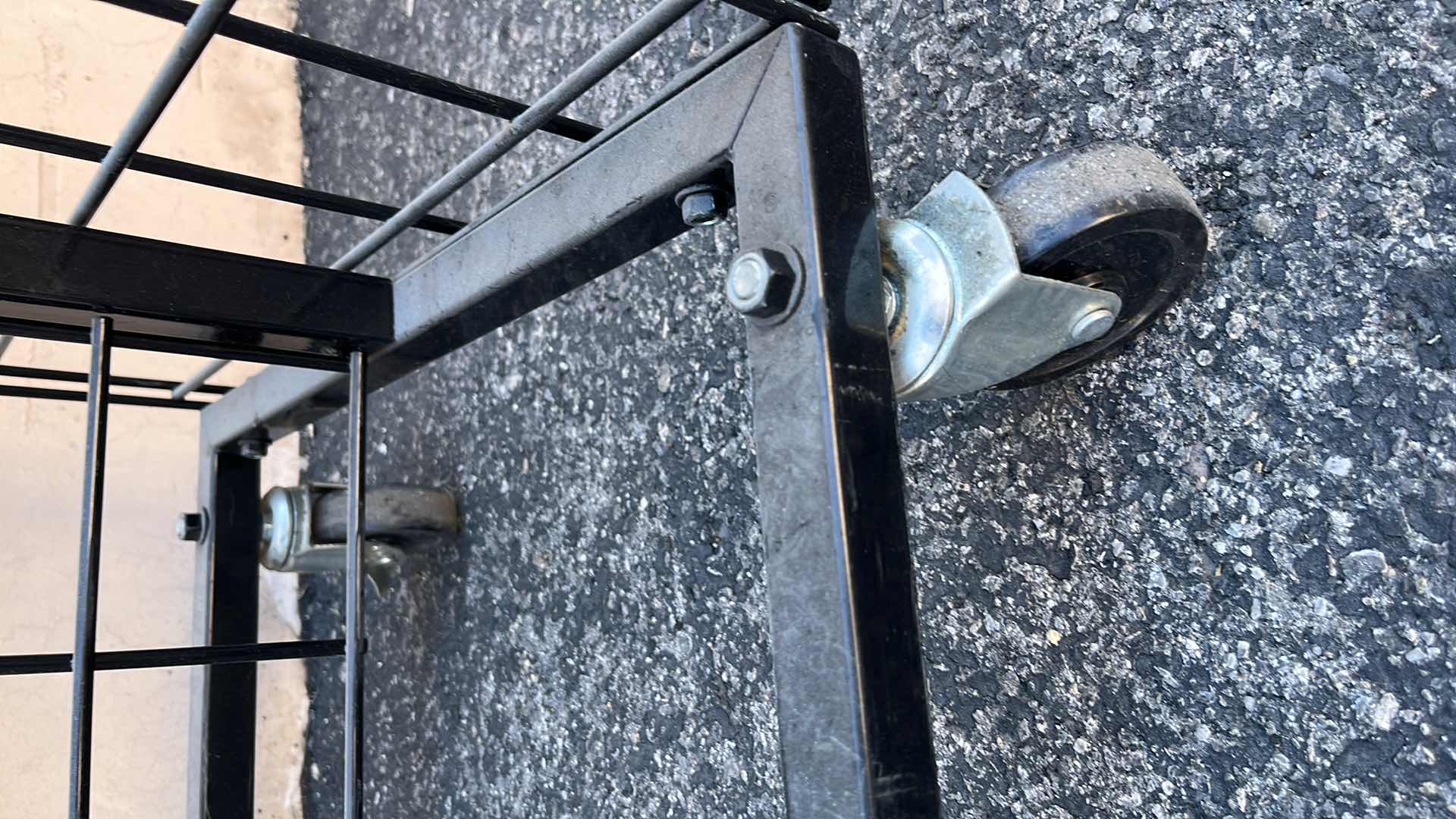 Photo 1 of DOUBLE SIDE MERCHANDISE RACK ON WHEELS 18” X 50.25” H56.5”, BLACK (1)