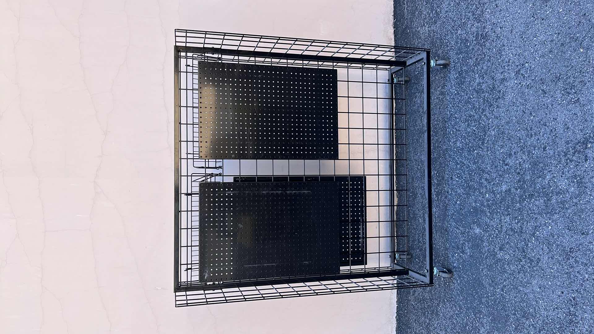 Photo 1 of DOUBLE SIDE MERCHANDISE RACK ON WHEELS 18” X 50.25” H56.5”, BLACK (1)