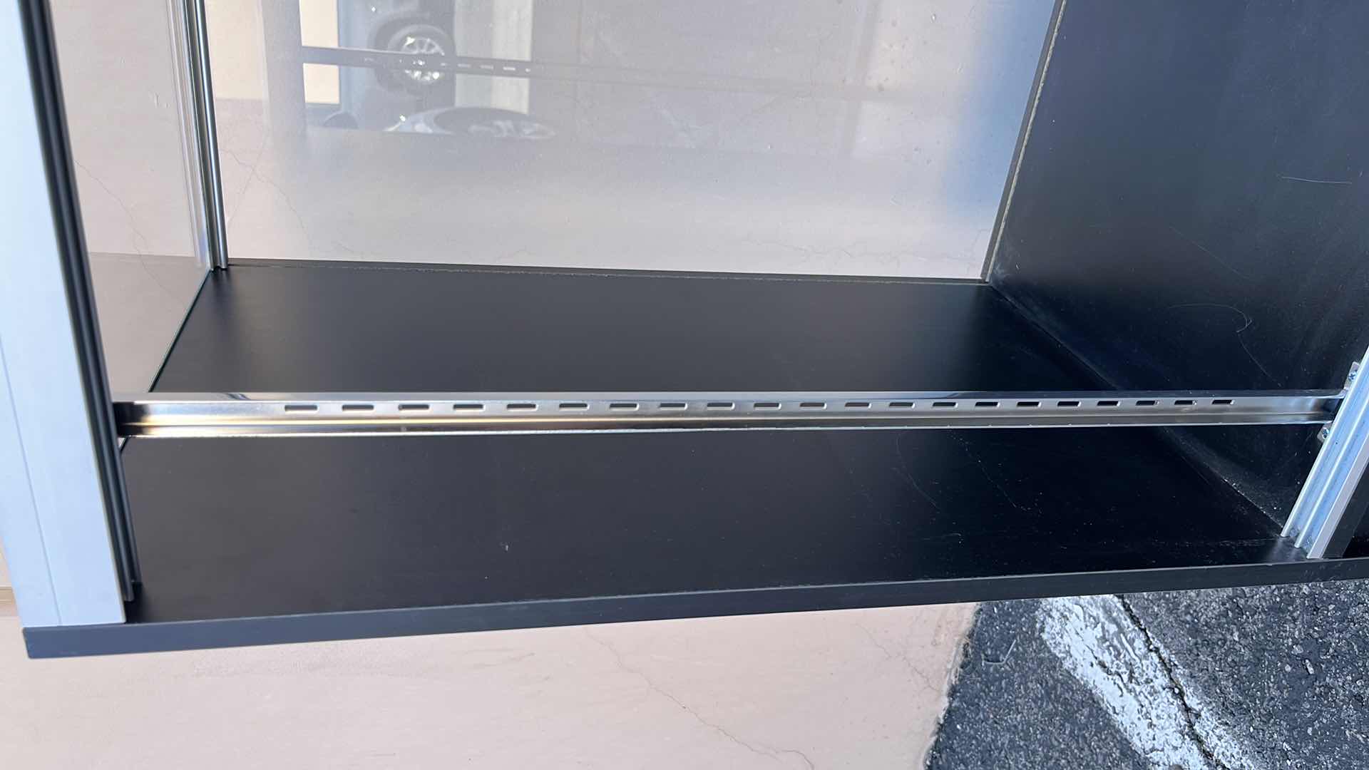 Photo 1 of GLASS MERCHANDISE DISPLAY CASE W 1 GLASS SHELF & 2 DOORS 18” X 48” H38.25”