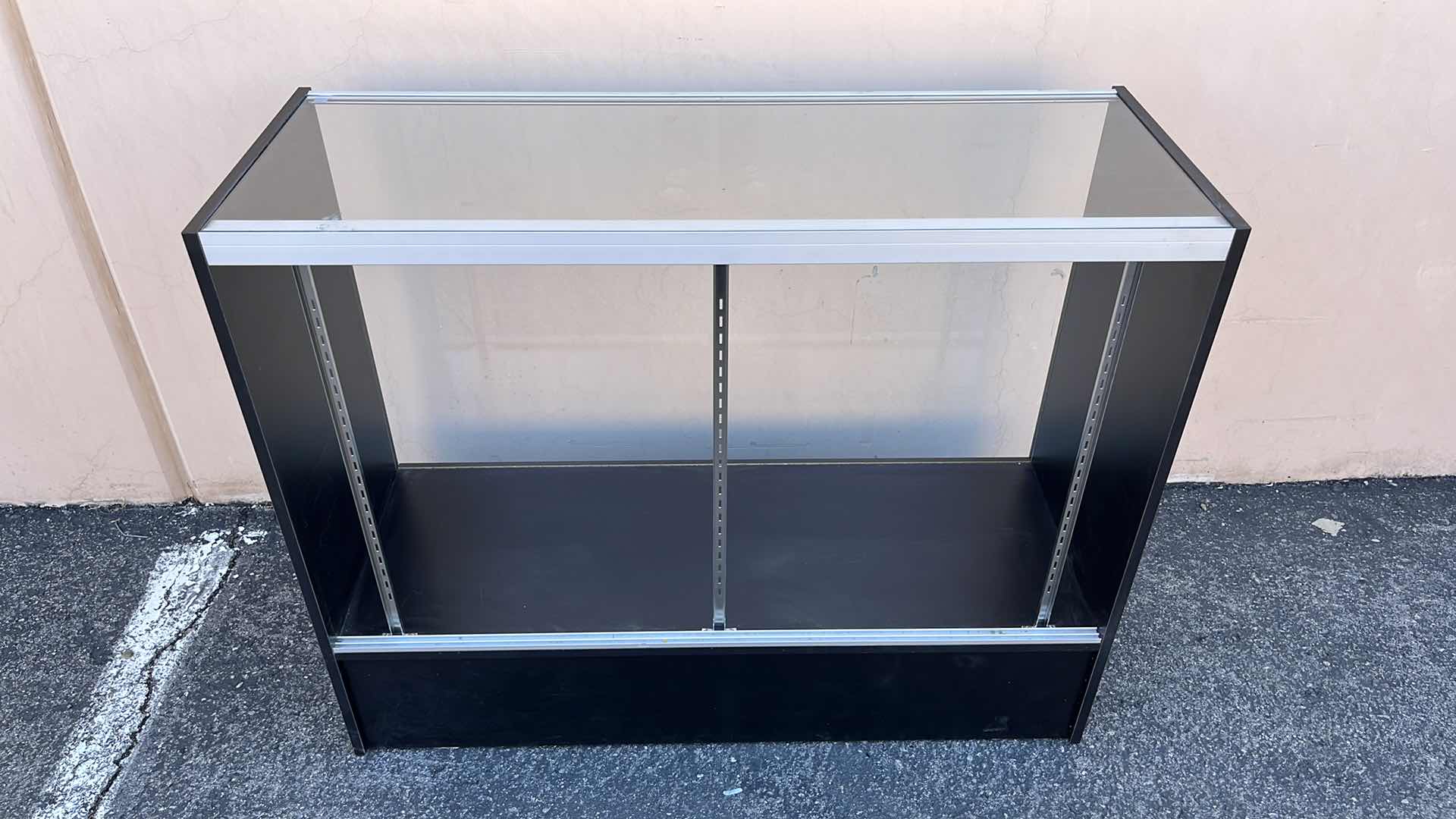 Photo 1 of GLASS MERCHANDISE DISPLAY CASE W 1 GLASS SHELF & 2 DOORS 18” X 48” H38.25”