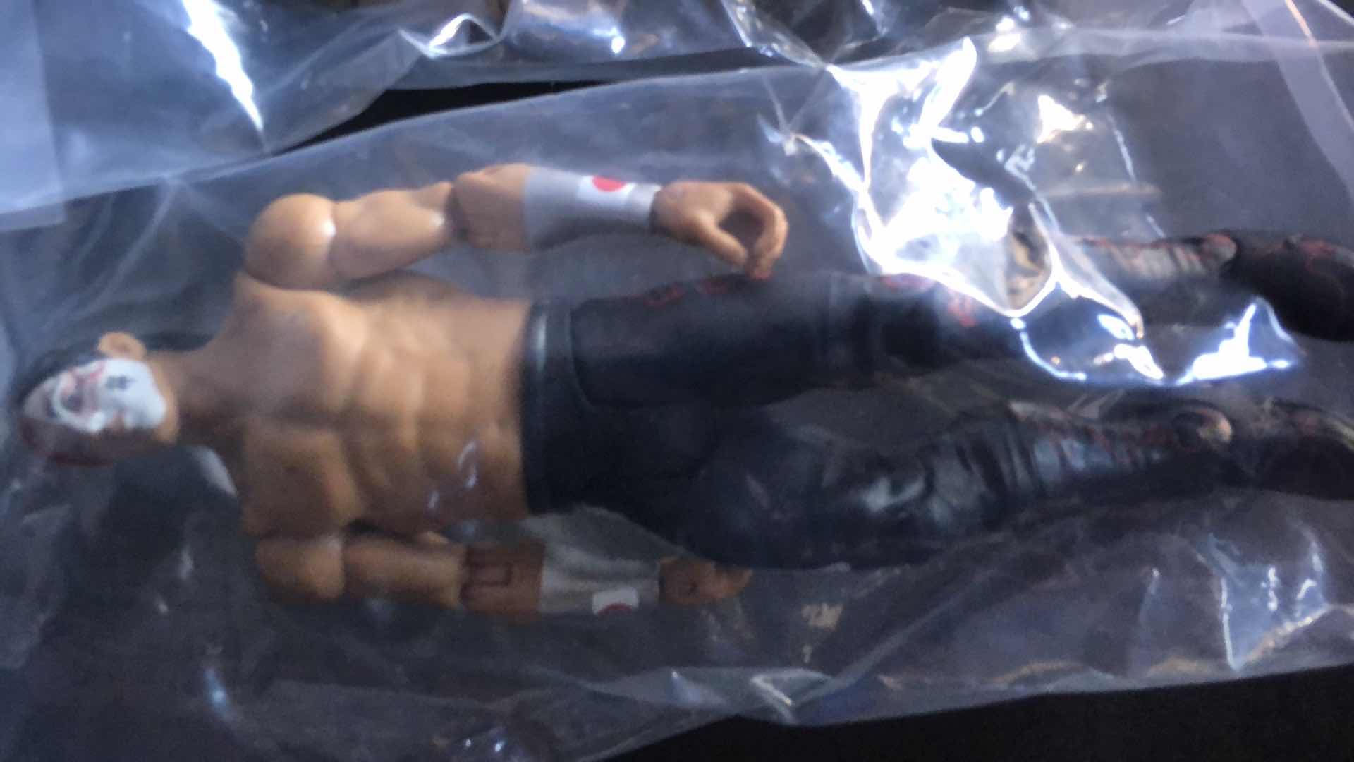 Photo 2 of ASSORTMENT OF UNBOXED WRESTLING ACTION FIGURES (4)