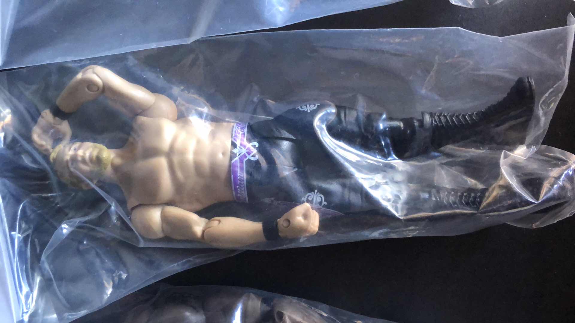 Photo 1 of ASSORTMENT OF UNBOXED WRESTLING ACTION FIGURES (4)