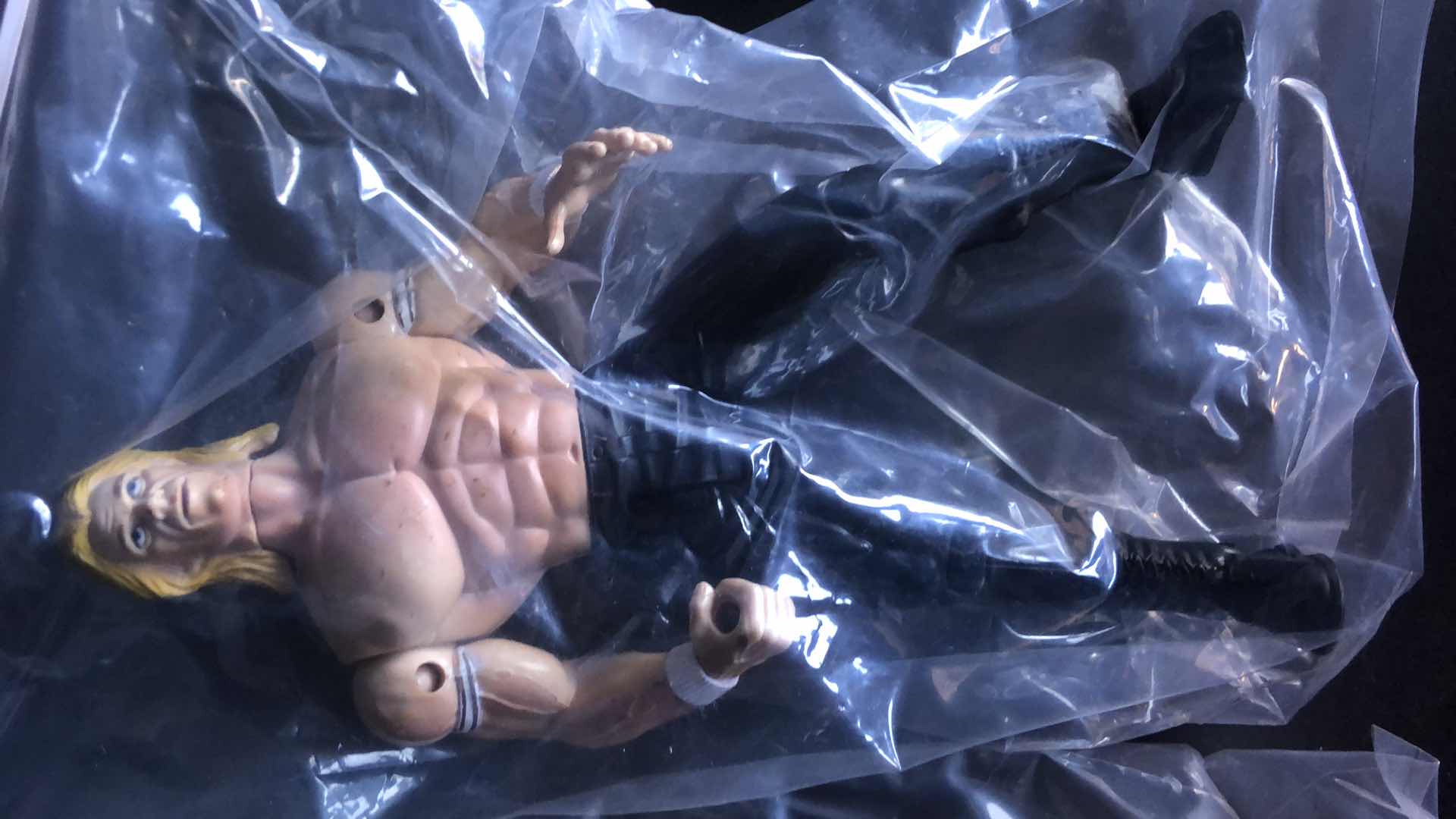 Photo 1 of ASSORTMENT OF UNBOXED WRESTLING ACTION FIGURES (4)