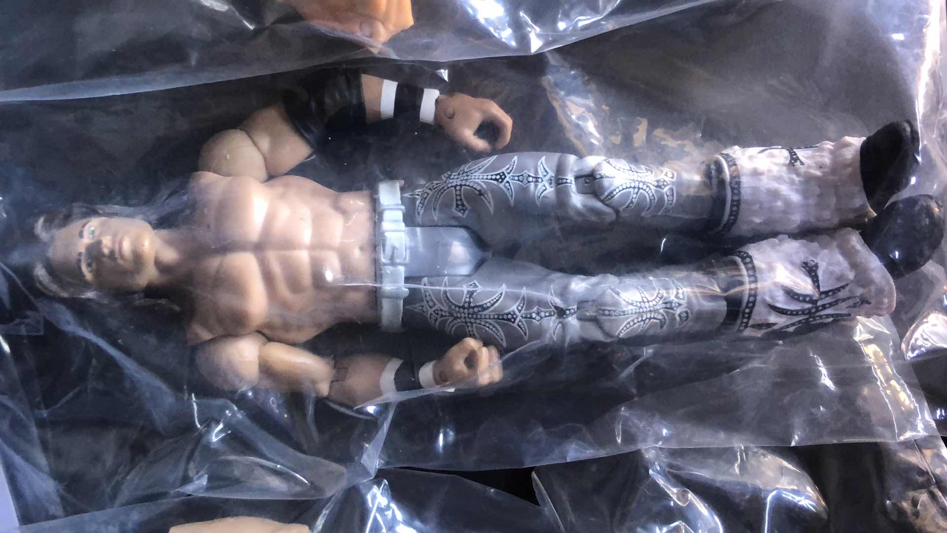 Photo 1 of ASSORTMENT OF UNBOXED WRESTLING ACTION FIGURES (4)