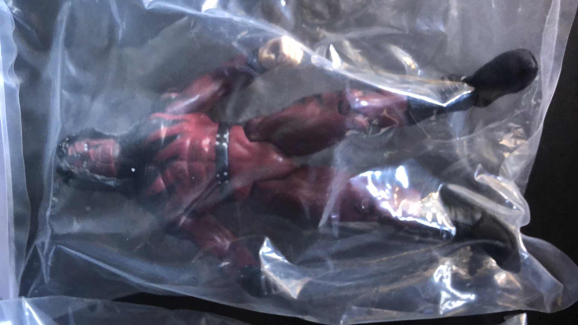 Photo 1 of ASSORTMENT OF UNBOXED WRESTLING ACTION FIGURES (4)