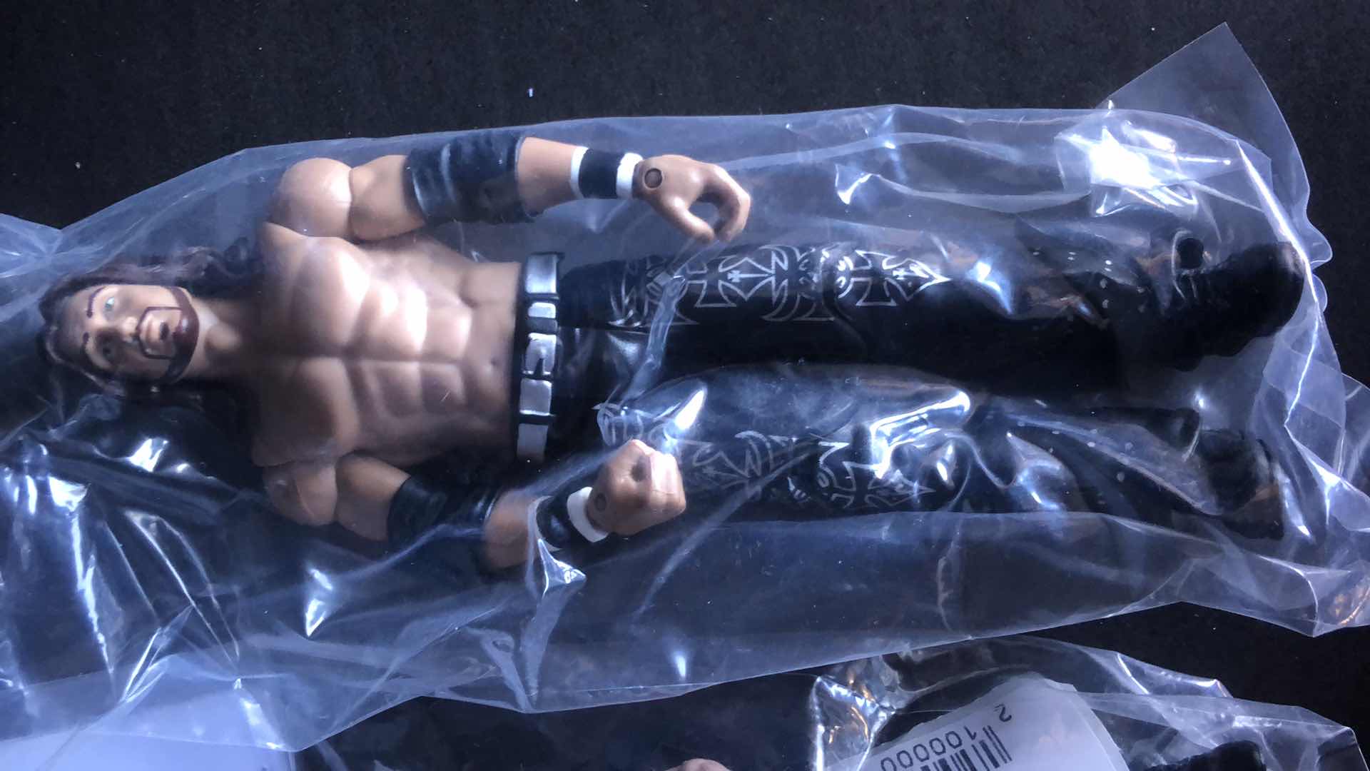 Photo 1 of ASSORTMENT OF UNBOXED WRESTLING ACTION FIGURES (4)
