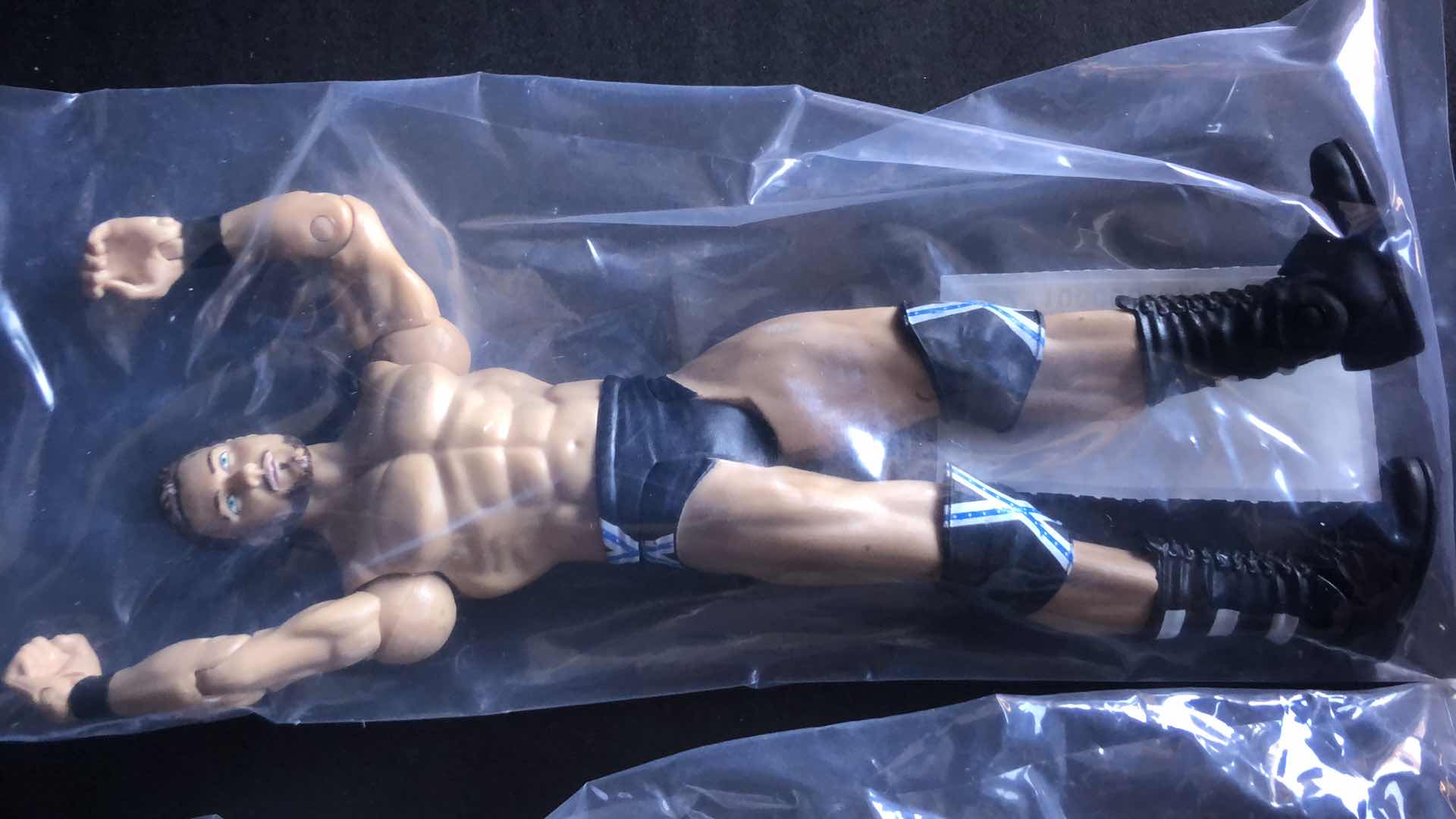 Photo 1 of ASSORTMENT OF UNBOXED WRESTLING ACTION FIGURES (4)