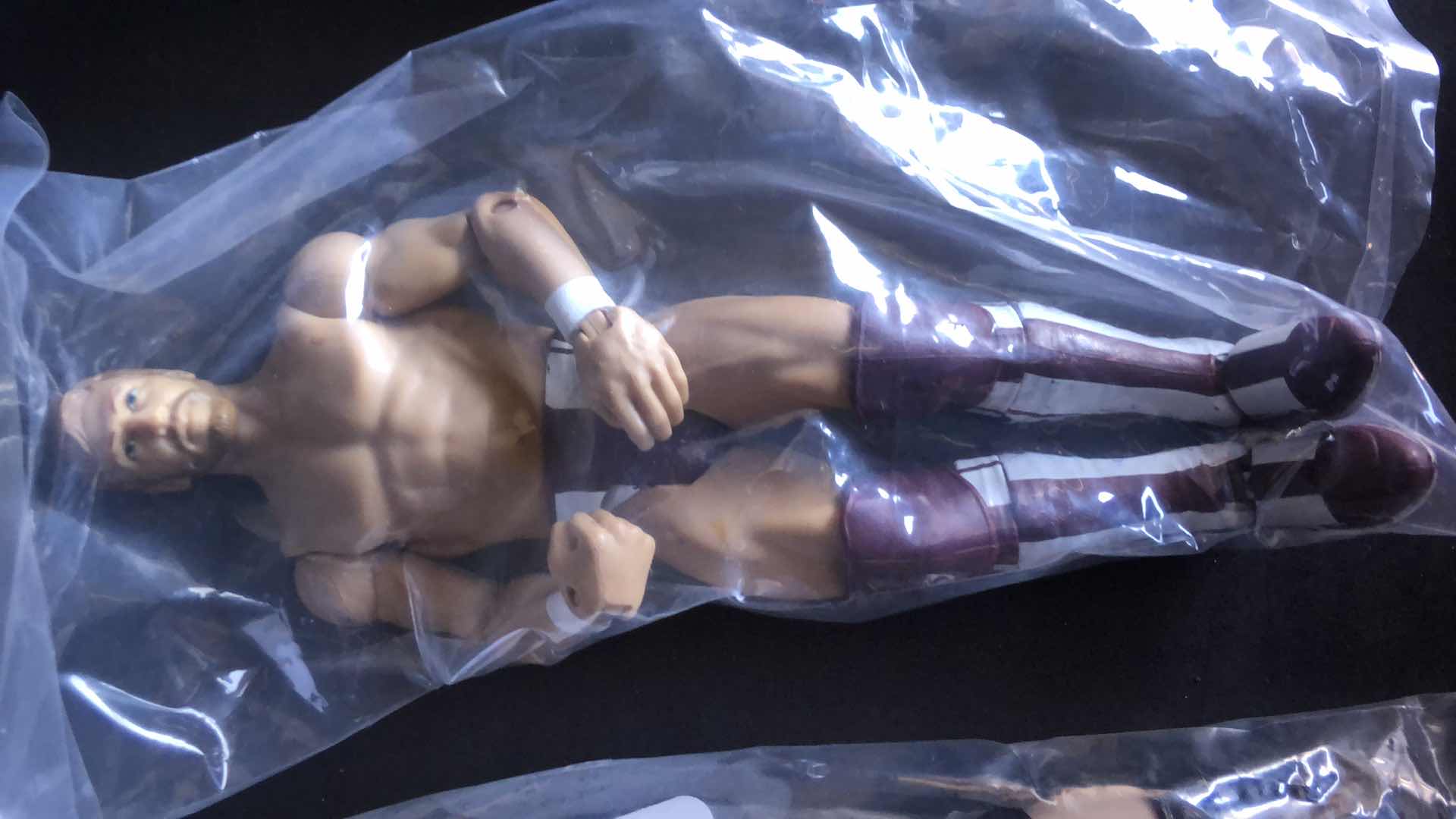 Photo 1 of ASSORTMENT OF UNBOXED WRESTLING ACTION FIGURES (4)