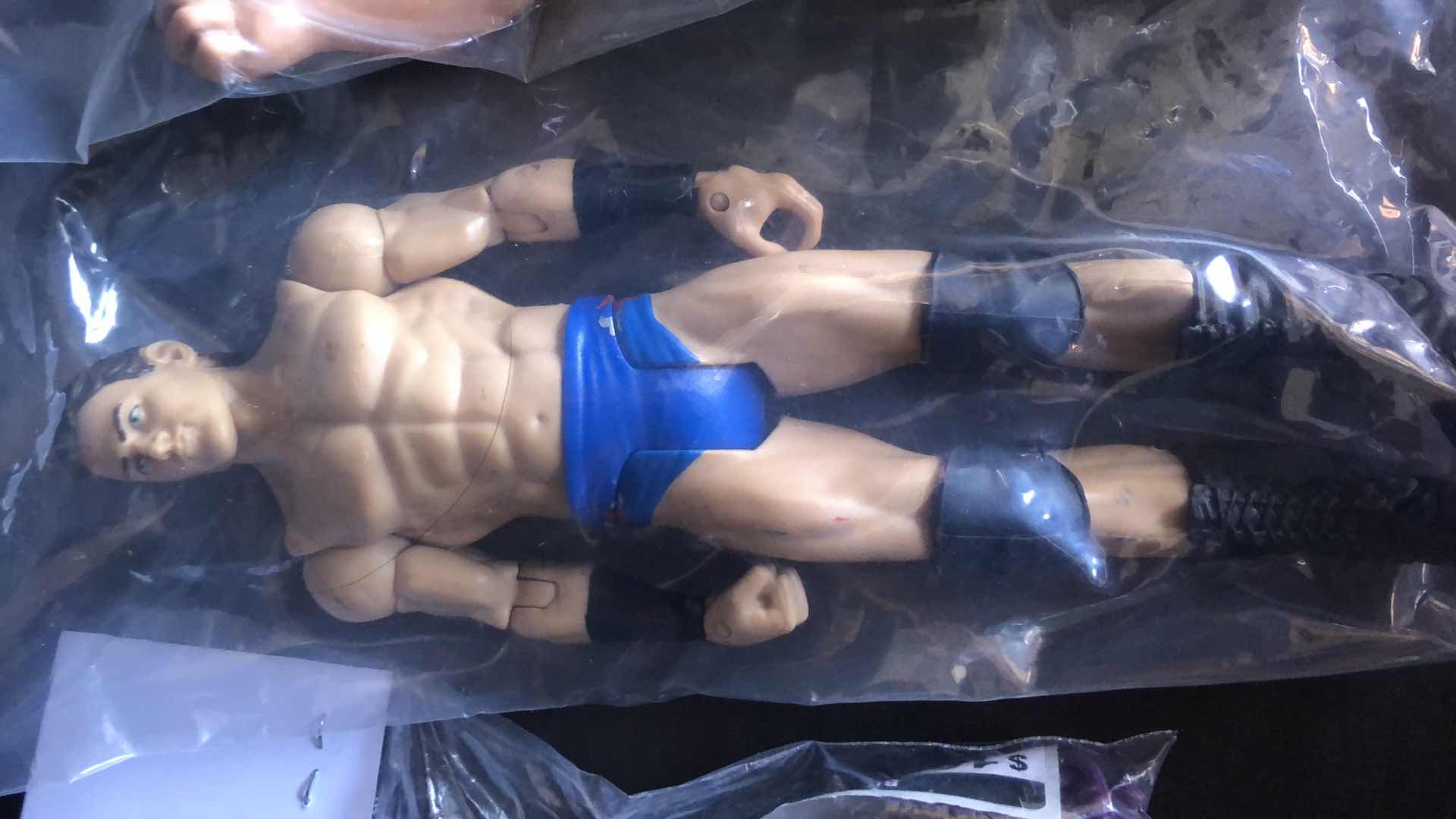 Photo 1 of ASSORTMENT OF UNBOXED WRESTLING ACTION FIGURES (4)