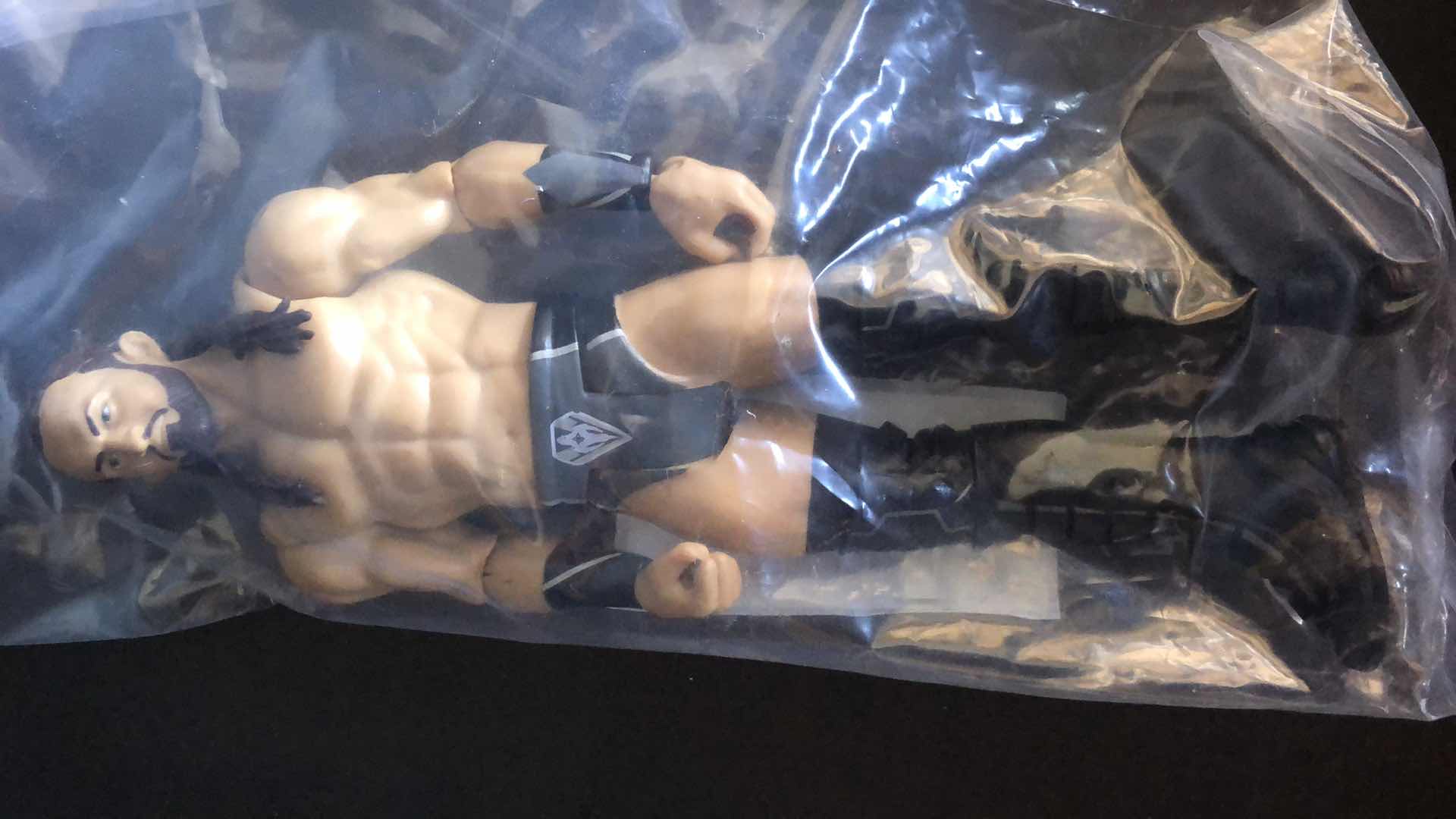 Photo 1 of ASSORTMENT OF UNBOXED WRESTLING ACTION FIGURES (4)