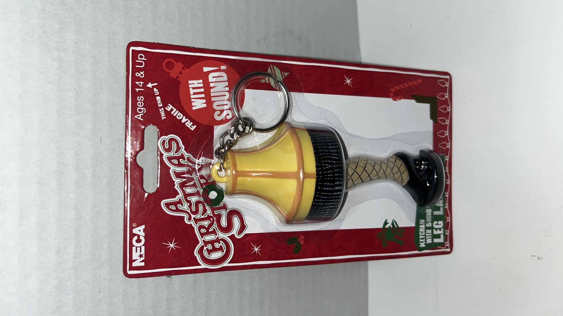 Photo 1 of BRAND NEW FUNKO GAMES A CHRISTMAS STORY “A MAJOR CARD GAME” & NECA A CHRISTMAS STORY LEG LAMP TALKING KEYCHAIN (2)