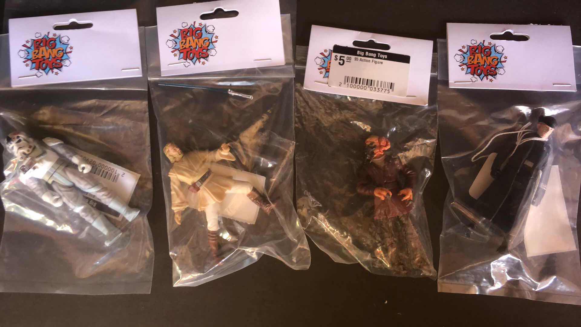 Photo 1 of ASSORTMENT OF UNBOXED ACTION FIGURES STOCKING STUFFERS (4)