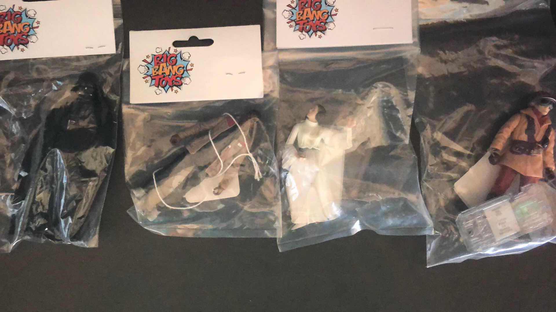 Photo 1 of ASSORTMENT OF UNBOXED ACTION FIGURES STOCKING STUFFERS (4)