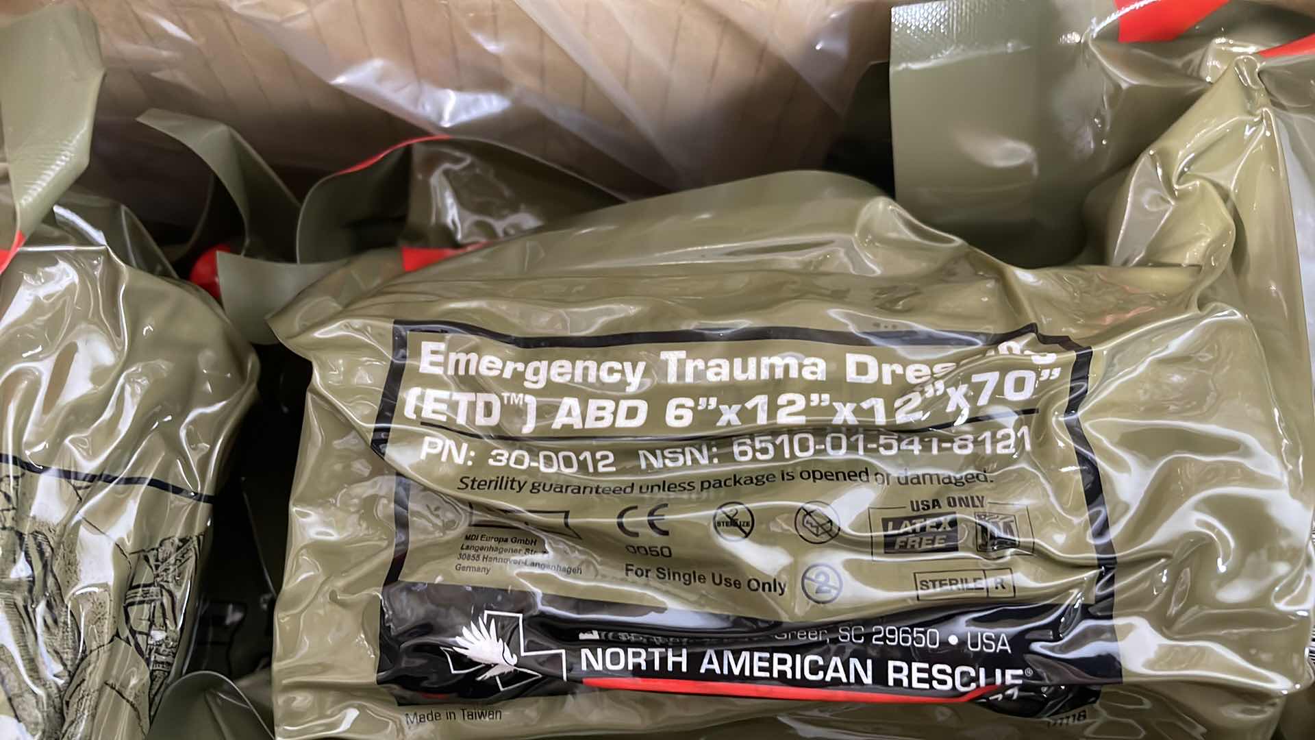 Photo 1 of EMERGENCY TRAUMA DRESSING 6” X 12” X 70” (25) EXP 6/23