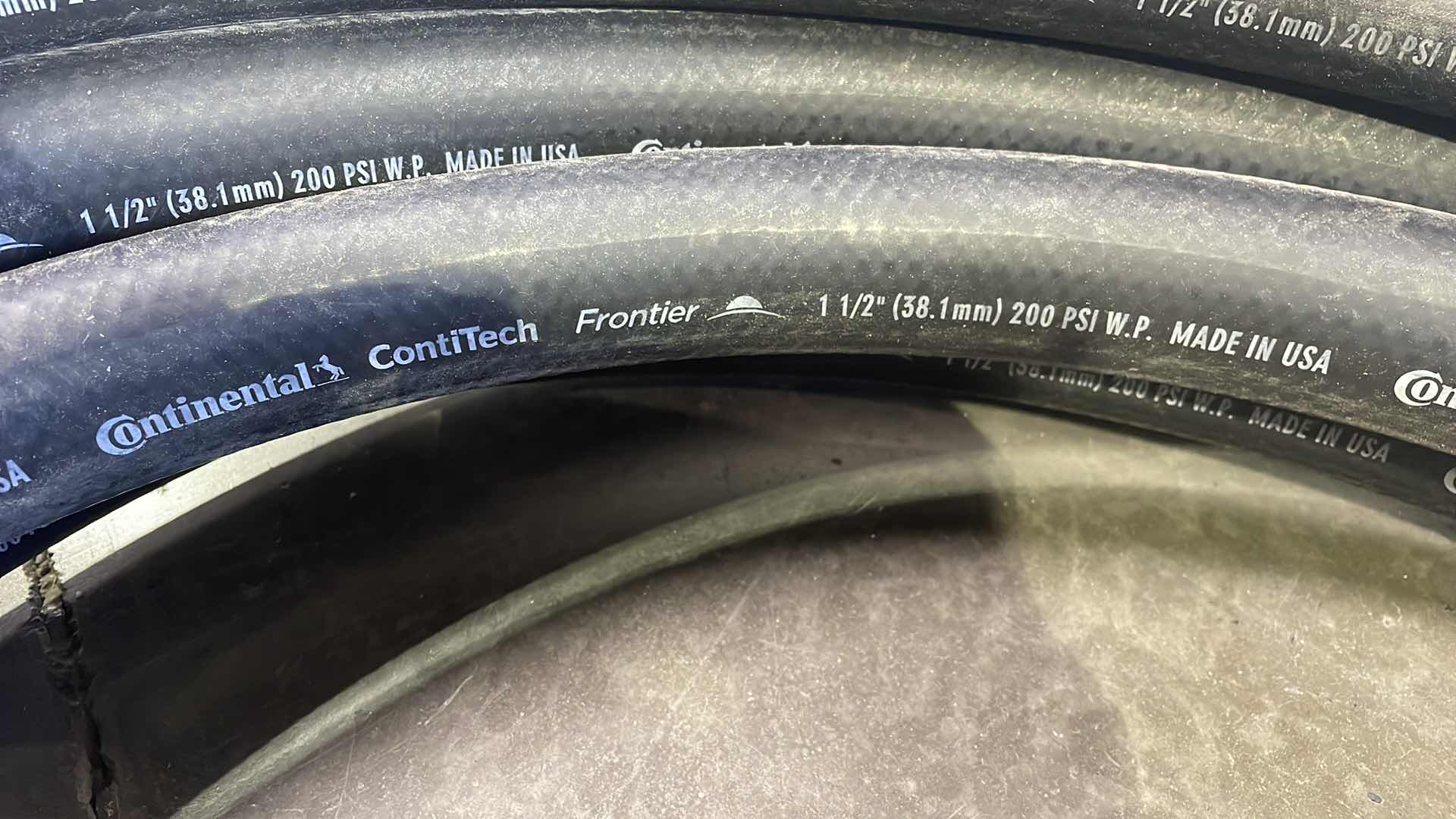 Photo 1 of CONTINENTAL CONTITECH FRONTIER 1-1/2” HOSE WITH CAMLOCK FITTINGS 25’ USA
