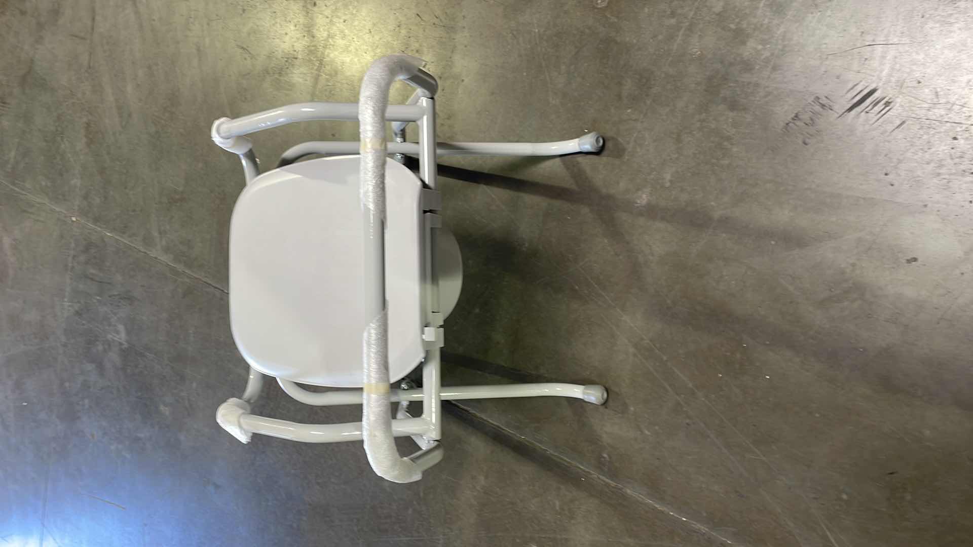 Photo 1 of PATTERSON MEDICAL 556402 SPACESAVER FOLDABLE COMMODE WITH ELONGATED SEAT