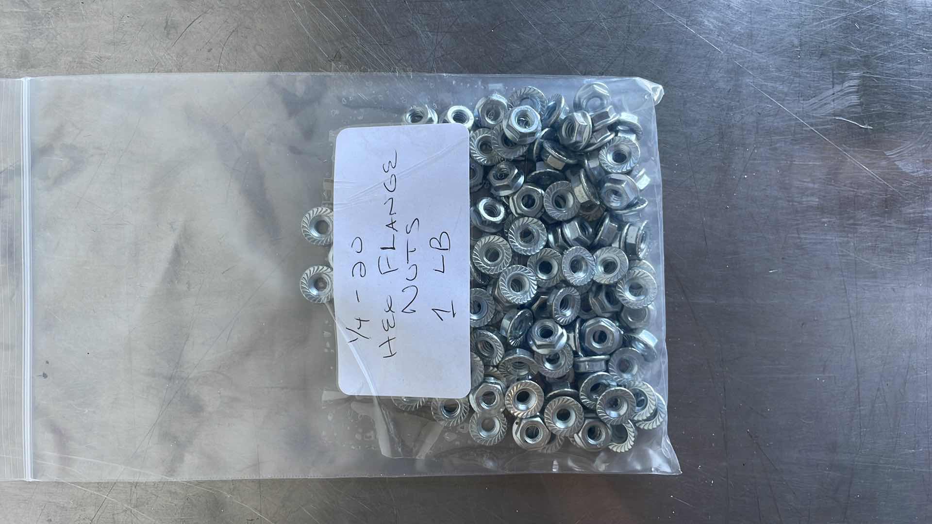 Photo 1 of 1/4-20 HEX FLANGE NUTS 1 LB
