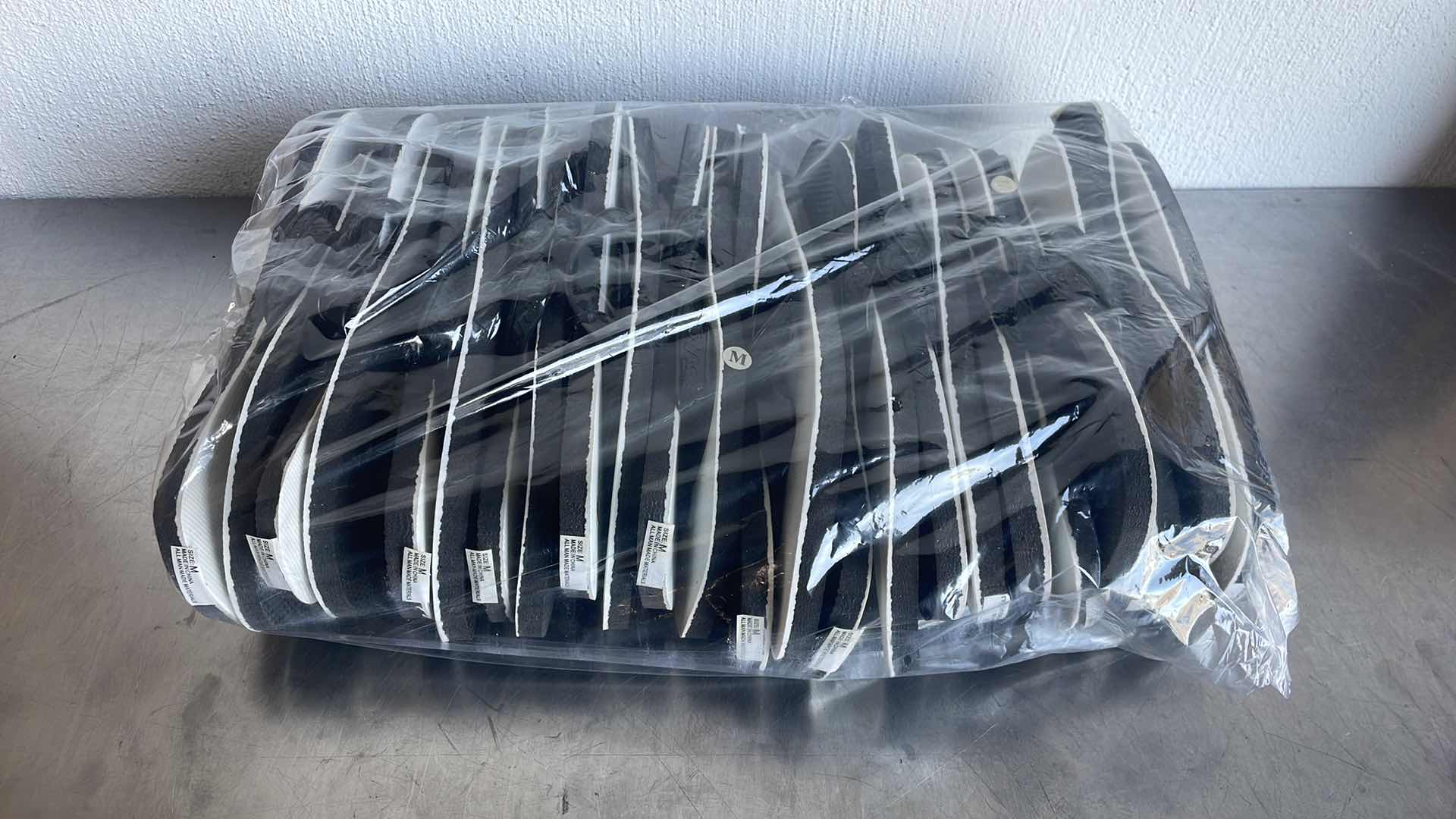 Photo 1 of BLACK AND WHITE THONGS/FLIP FLOPS SIZE MEDIUM (12)