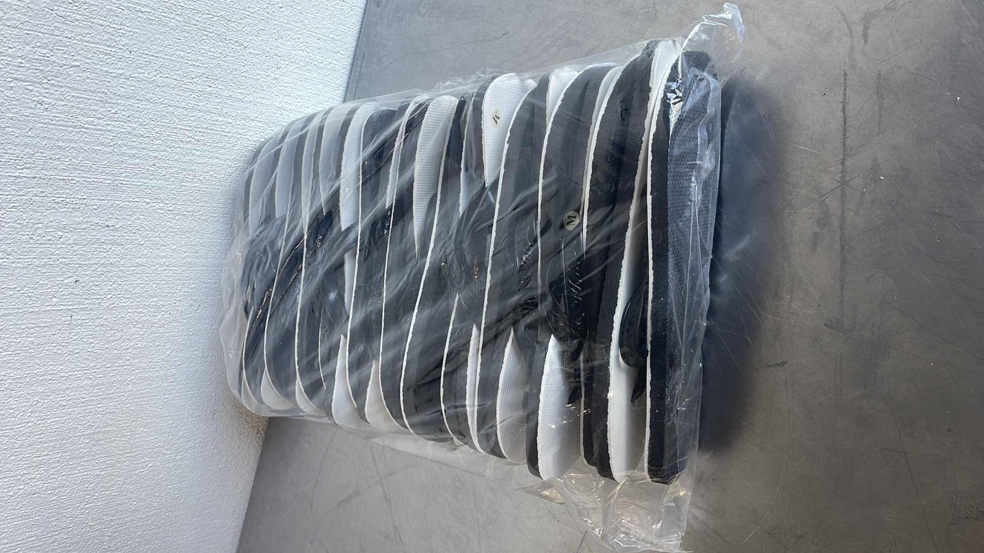 Photo 1 of BLACK AND WHITE THONGS/FLIP FLOPS SIZE MEDIUM (12)