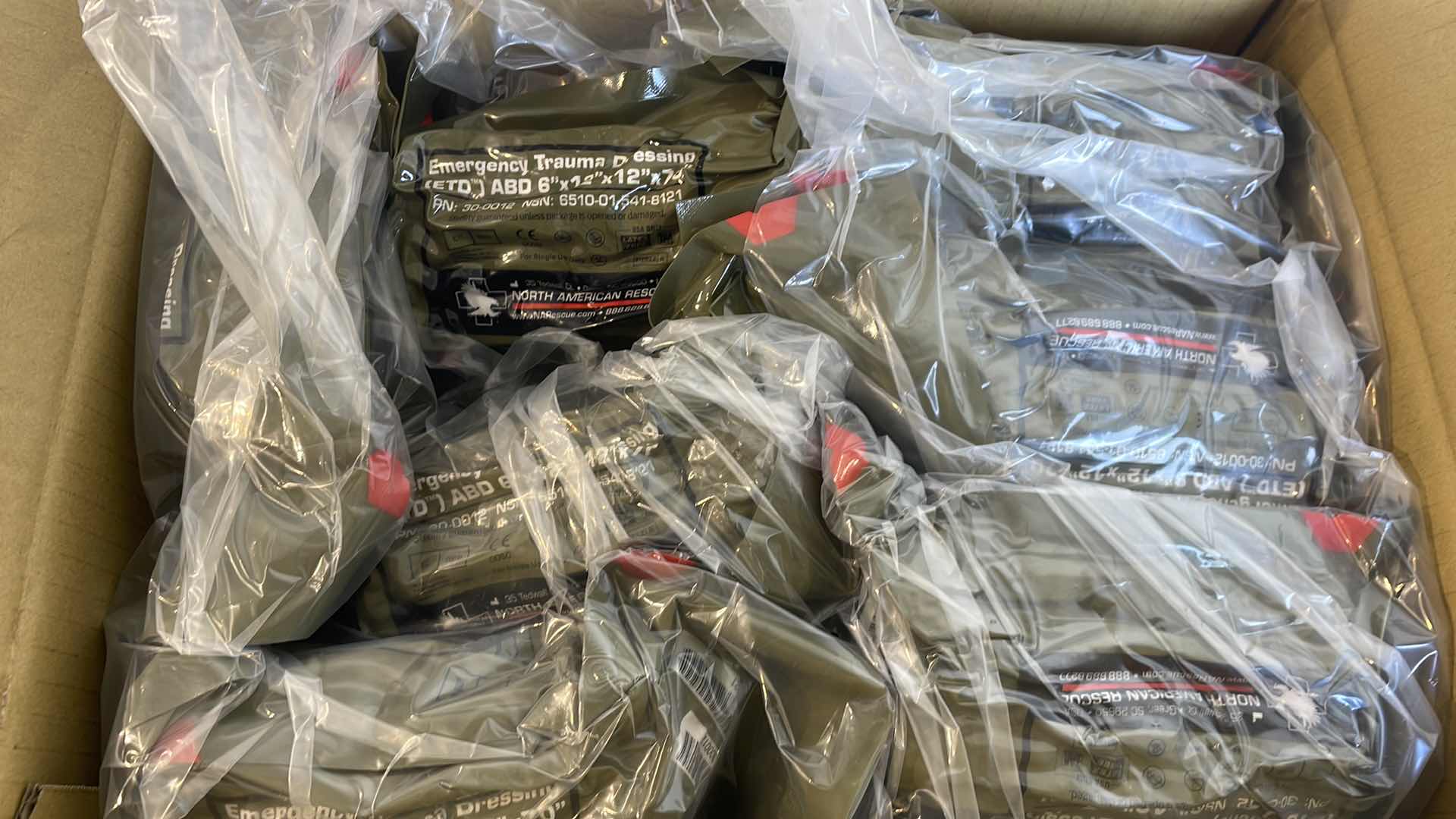 Photo 1 of EMERGENCY TRAUMA DRESSING 6” X 12” X 70” (25) EXP 6/23