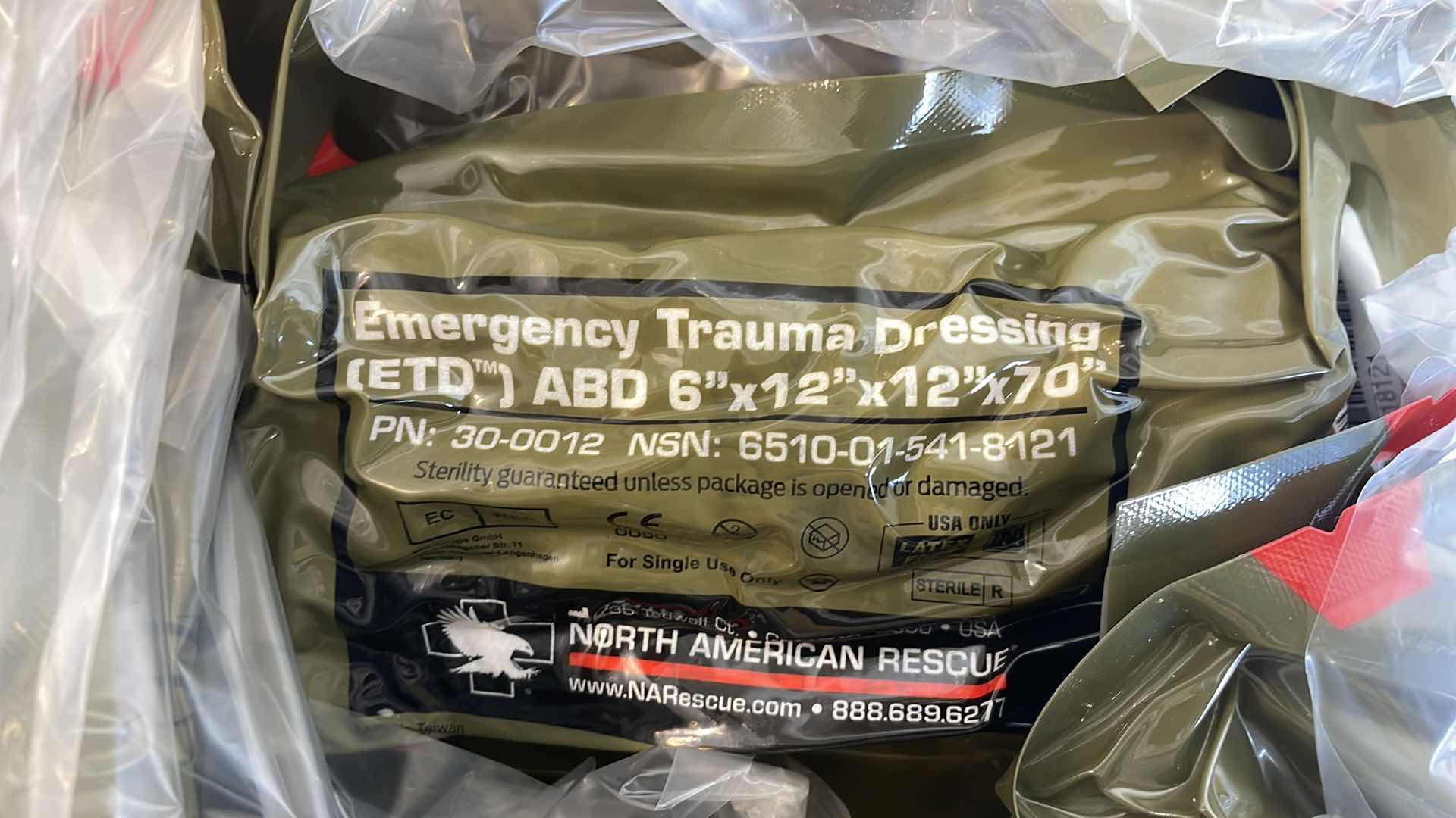 Photo 1 of EMERGENCY TRAUMA DRESSING 6” X 12” X 70” (25) EXP 6/23