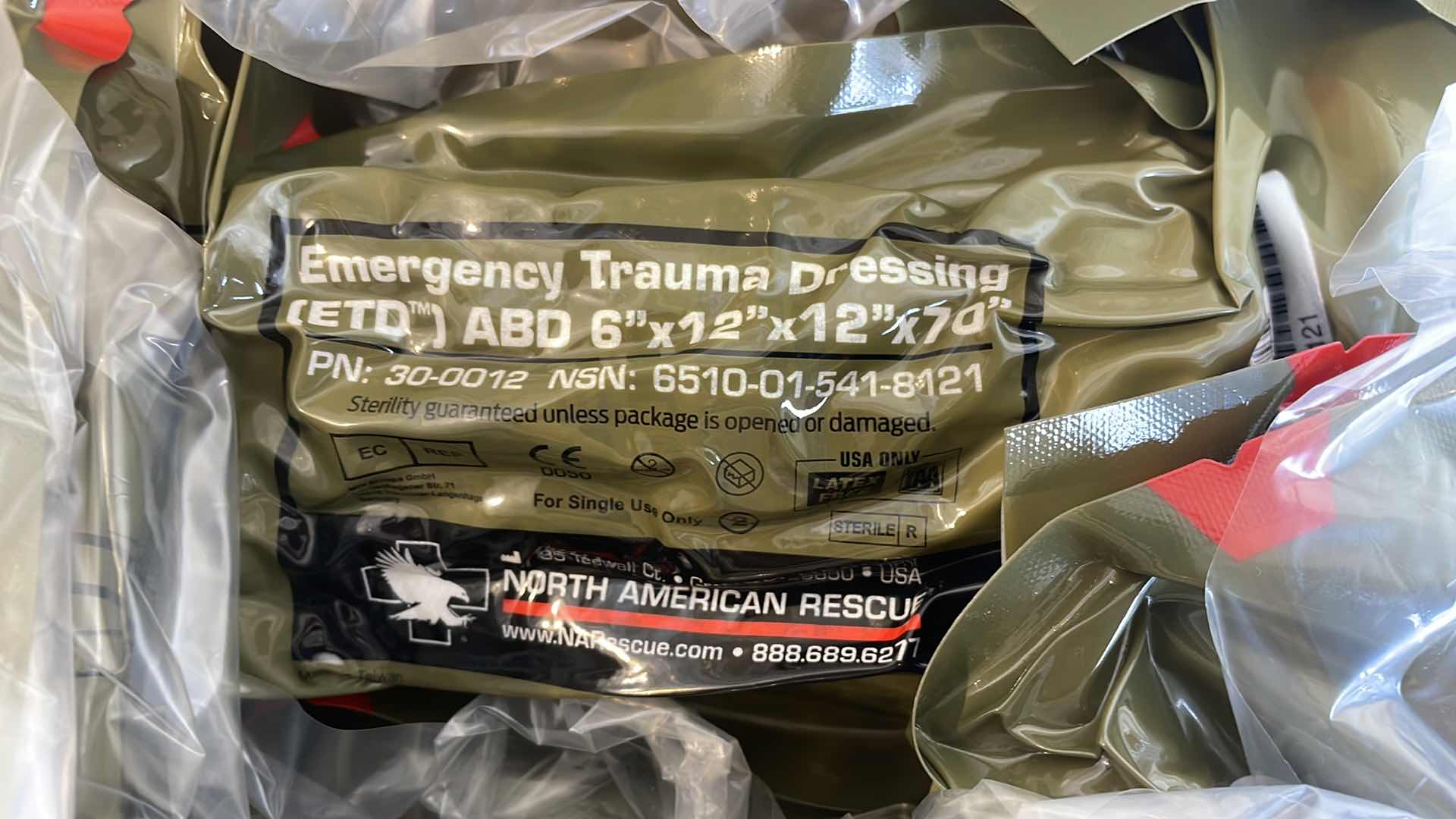 Photo 1 of EMERGENCY TRAUMA DRESSING 6” X 12” X 70” (25) EXP 6/23