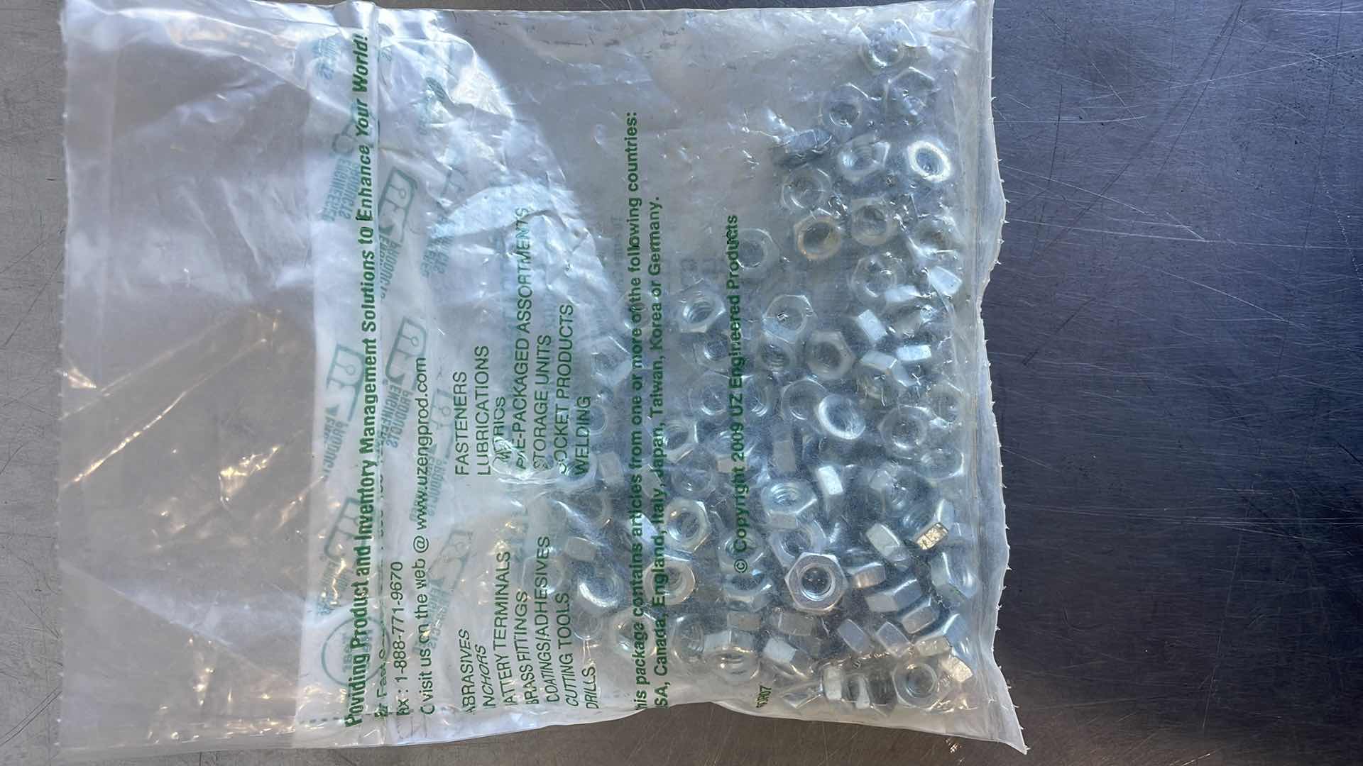 Photo 1 of HEX MACHINE SCREW NUTS 1/4-20 ZINC (100)