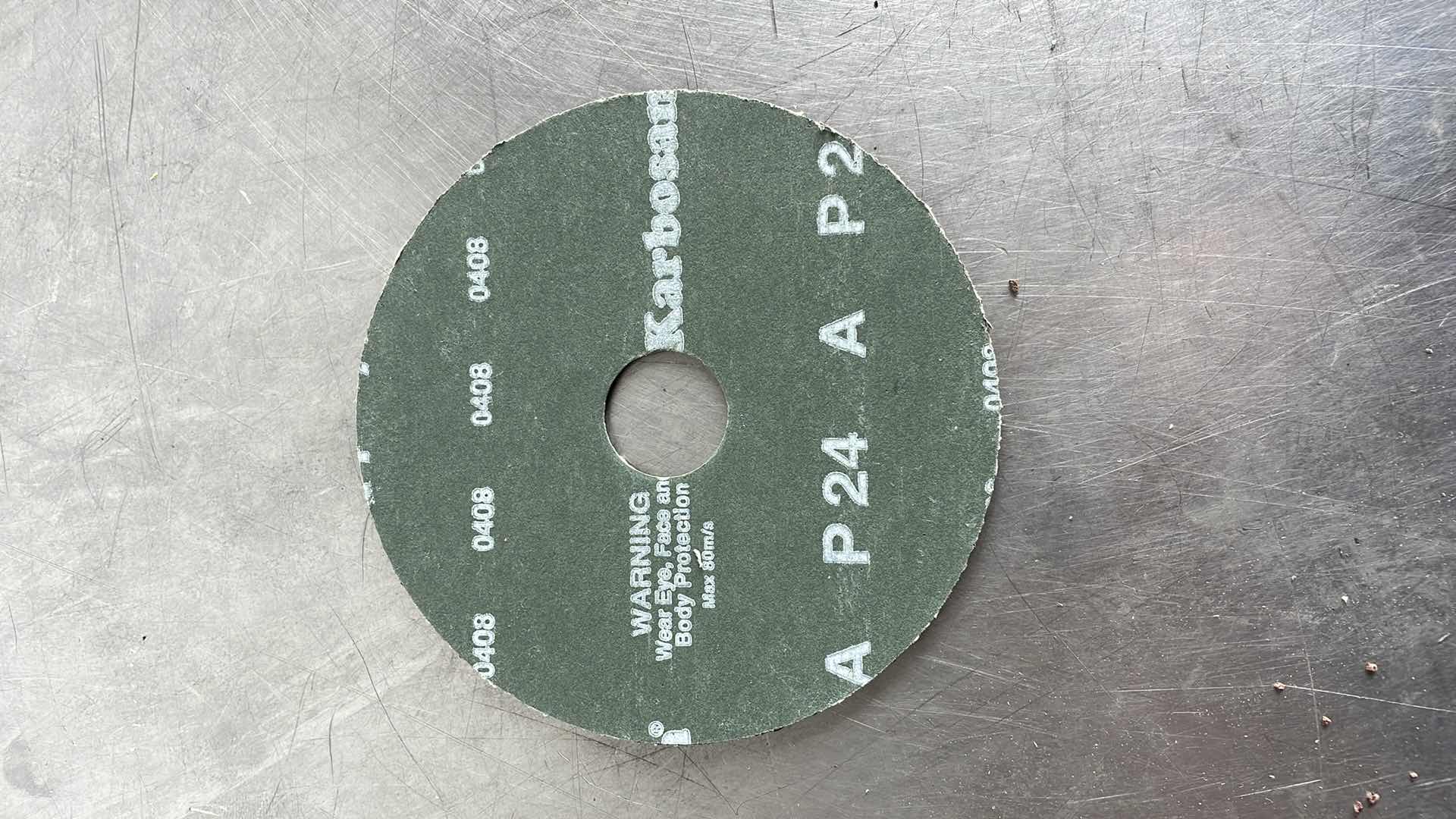 Photo 1 of ALUMINUM OXIDE RESIN FIBER 4-INCH RESIN FIBER SANDING DISCS CENTER HOLE 24 GRIT SANDING DISC FOR ANGLE GRINDER (22)