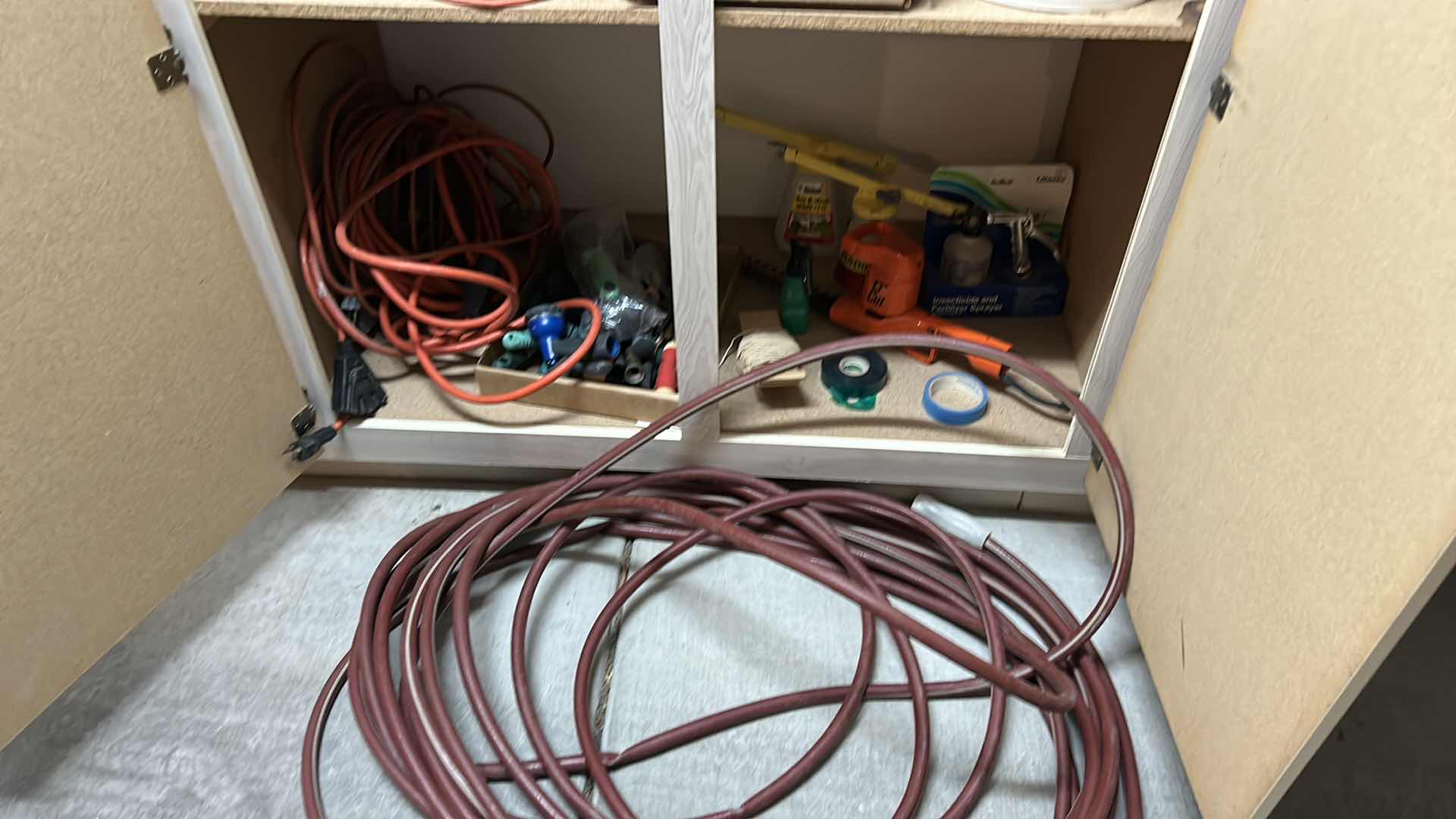 Photo 1 of CONTENTS OF SHELF IN GARAGE INCLUDING LARGE HOSE