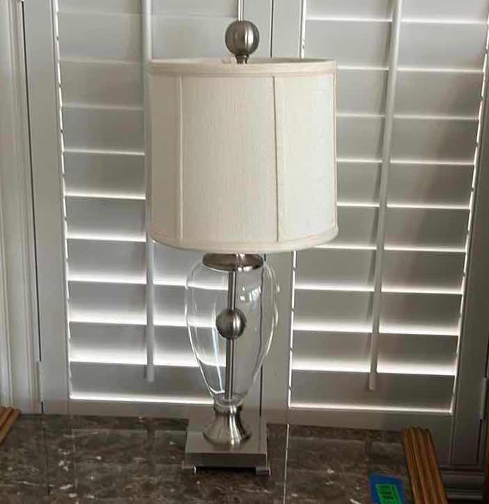 Photo 1 of CHROME AND GLASS TABLE LAMP W CREAM LINEN SHADE H28”