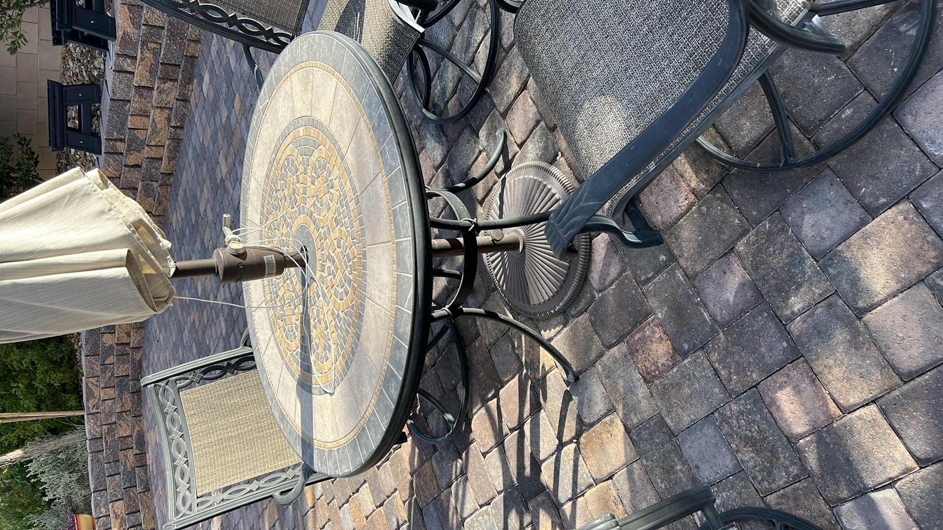 Photo 4 of OUTDOOR 42” ROUND PATIO TABLE WITH 4 SWIVEL ROCKING CHAIRS (UMBRELLA IS BROKEN)