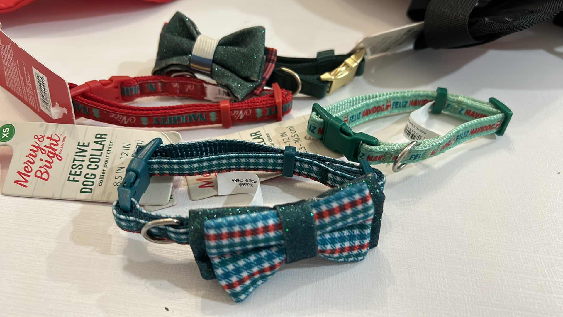 Photo 1 of NEW SMALL DOG ASSORTMENT, 1 BACKPACK/SADDLE BAG, 2 TOP PAW TEE SHIRTS, 4 COLLARS, 1 TOP PAW DOG HAT AND A SNUFFLE MAT