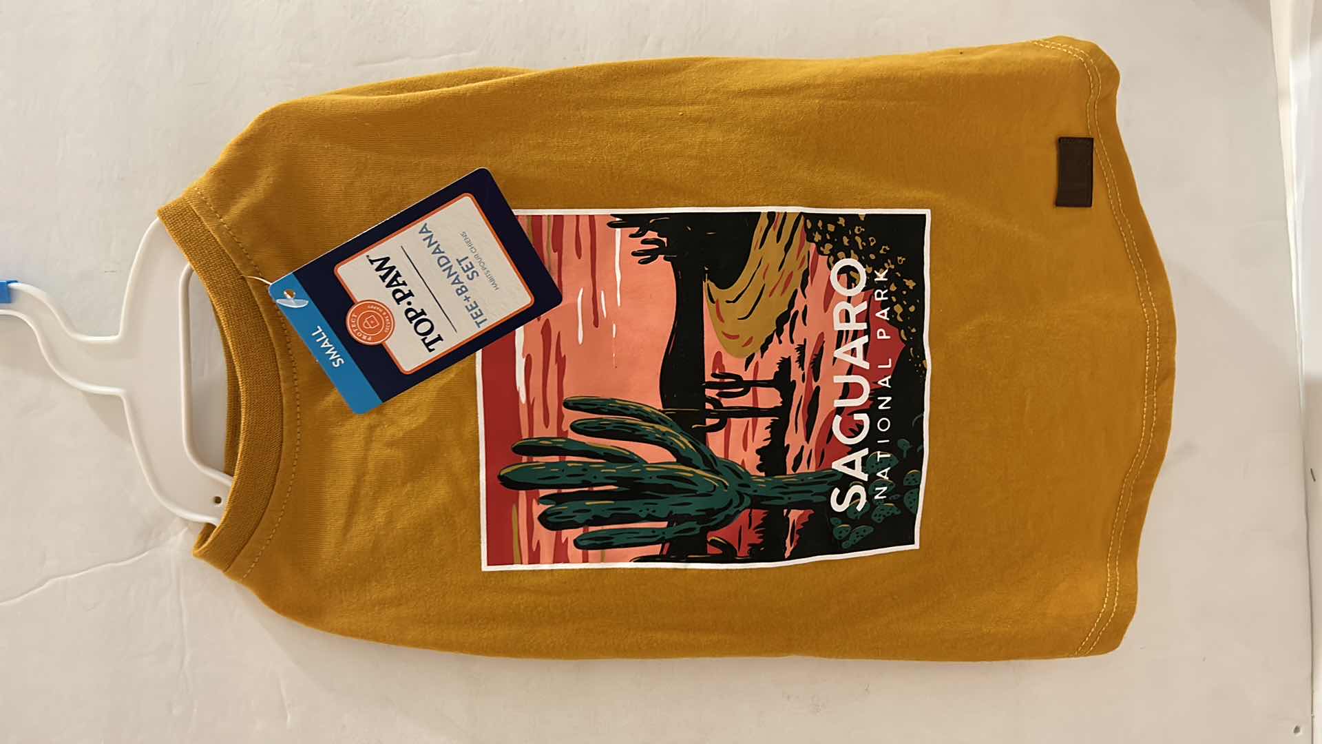 Photo 1 of NEW SMALL DOG ASSORTMENT, 1 BACKPACK/SADDLE BAG, 2 TOP PAW TEE SHIRTS, 4 COLLARS, 1 TOP PAW DOG HAT AND A SNUFFLE MAT