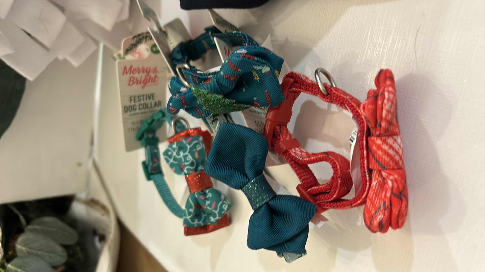 Photo 1 of NEW SMALL DOG ASSORTMENT, 1 BACKPACK/SADDLE BAG, 2 TOP PAW TEE SHIRTS, 4 COLLARS, 1 TOP PAW DOG HAT AND A SNUFFLE MAT