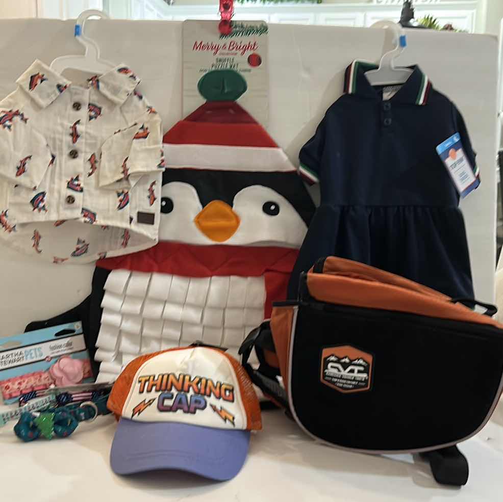 Photo 1 of NEW SMALL DOG ASSORTMENT, 1 BACKPACK/SADDLE BAG, 2 TOP PAW SHIRTS, 4 COLLARS, 1 TOP PAW DOG HAT AND A SNUFFLE MAT