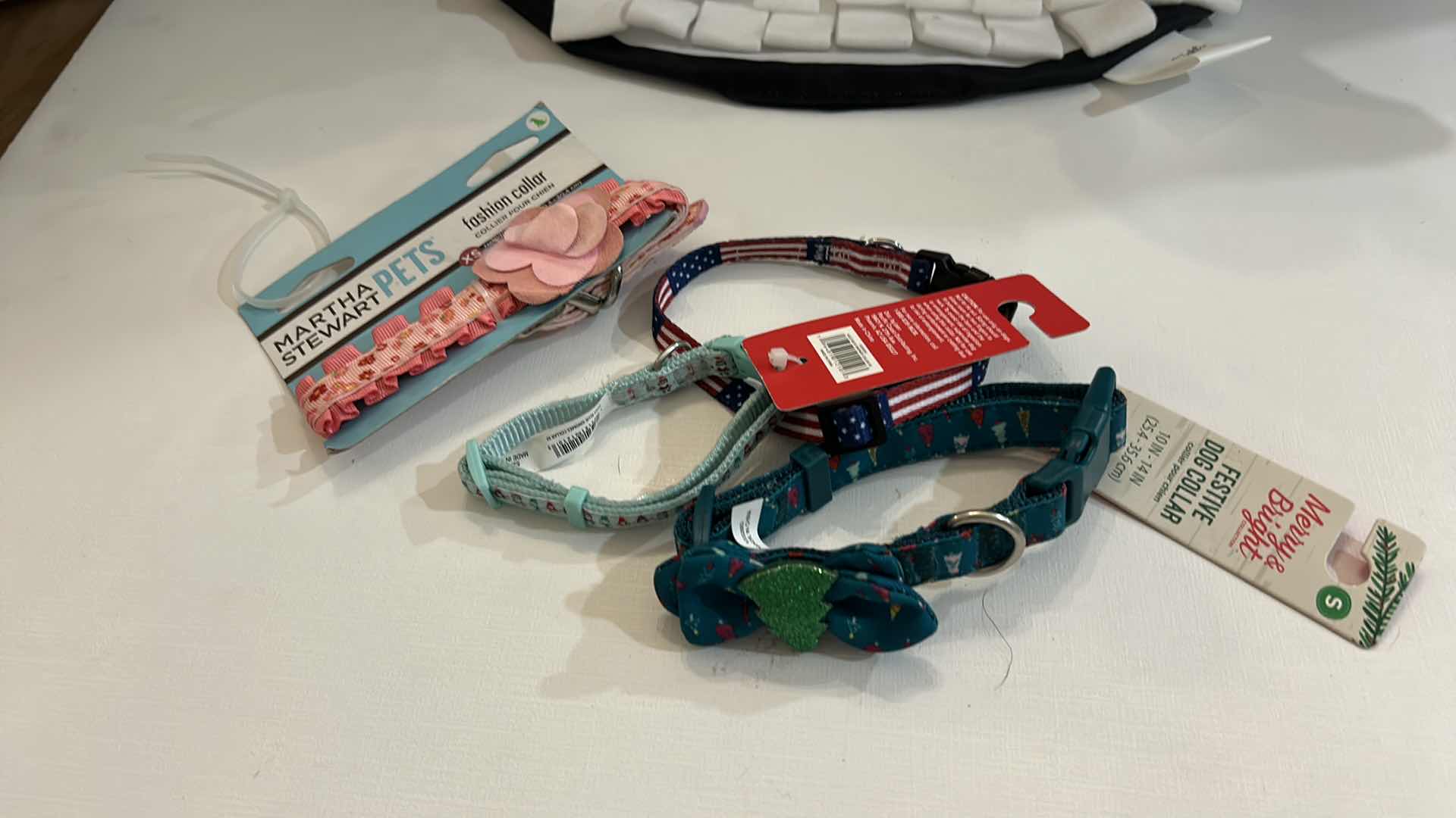 Photo 1 of NEW SMALL DOG ASSORTMENT, 1 BACKPACK/SADDLE BAG, 2 TOP PAW SHIRTS, 4 COLLARS, 1 TOP PAW DOG HAT AND A SNUFFLE MAT