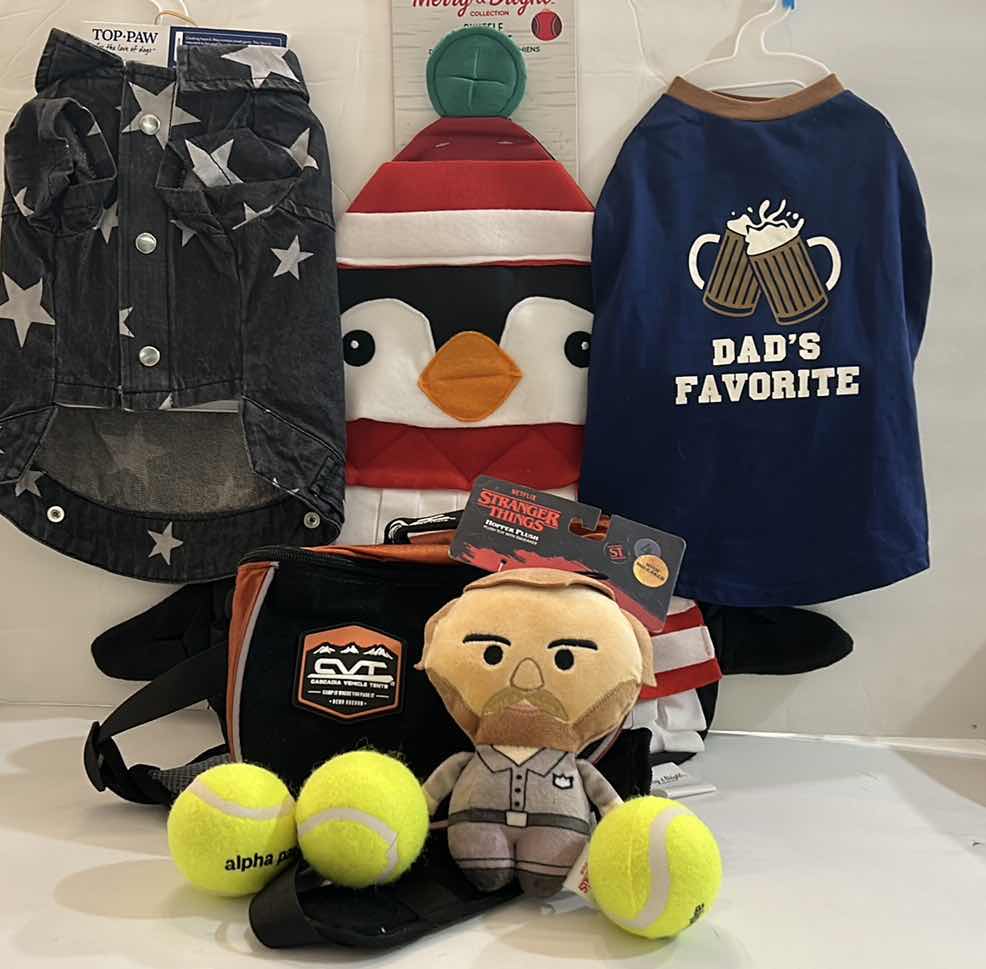 Photo 1 of NEW SMALL DOG ASSORTMENT, 1 BACKPACK/SADDLE BAG, 2 TOP PAW TEE SHIRTS, 1 SNUFFLE MAT, 1 SQUEAKER TOY
