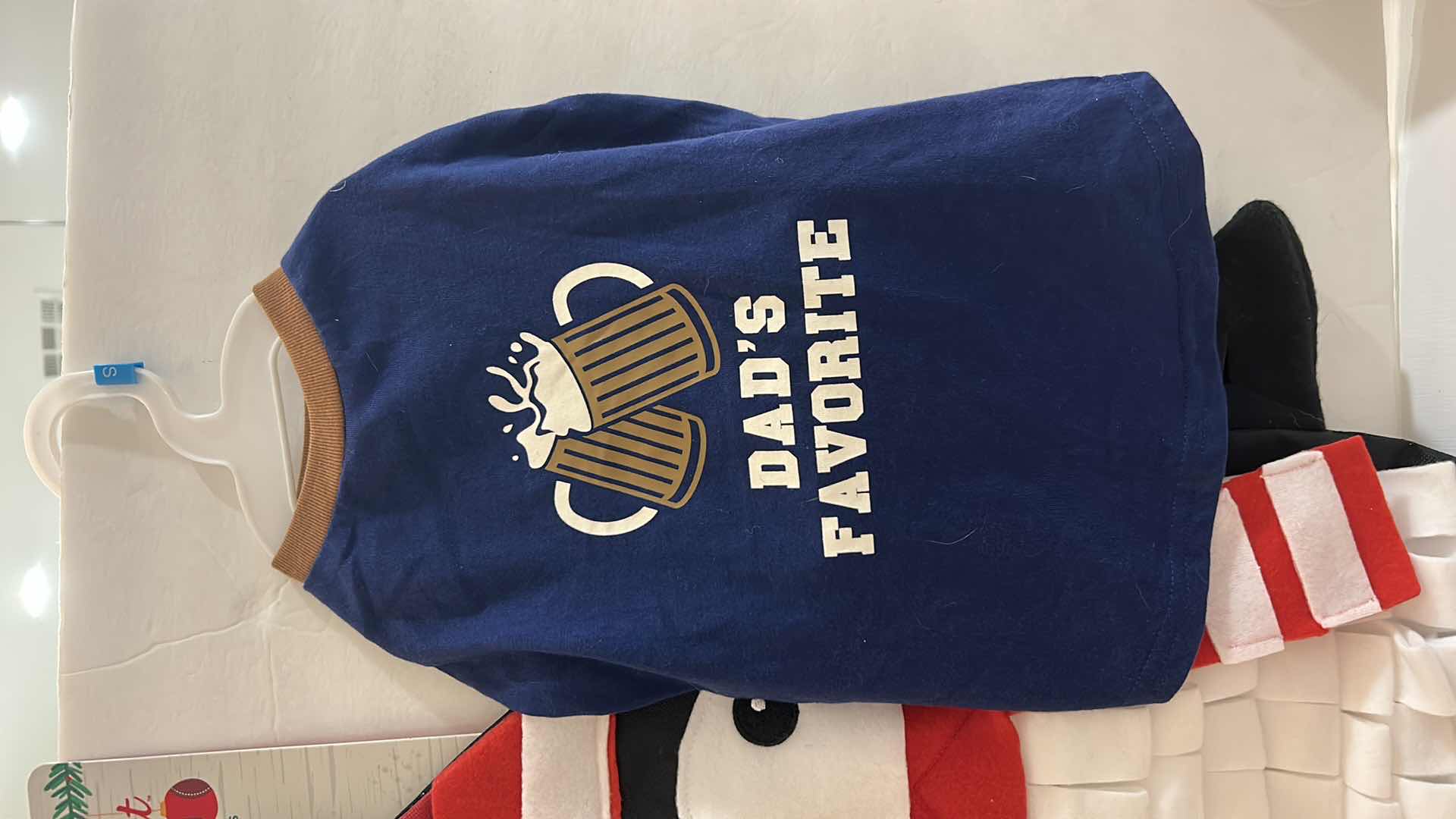 Photo 1 of NEW SMALL DOG ASSORTMENT, 1 BACKPACK/SADDLE BAG, 2 TOP PAW TEE SHIRTS, 1 SNUFFLE MAT, 1 SQUEAKER TOY