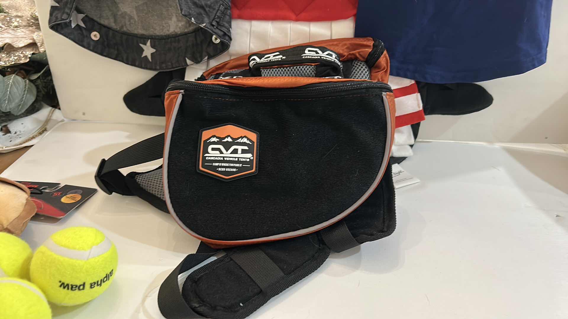 Photo 1 of NEW SMALL DOG ASSORTMENT, 1 BACKPACK/SADDLE BAG, 2 TOP PAW TEE SHIRTS, 1 SNUFFLE MAT, 1 SQUEAKER TOY