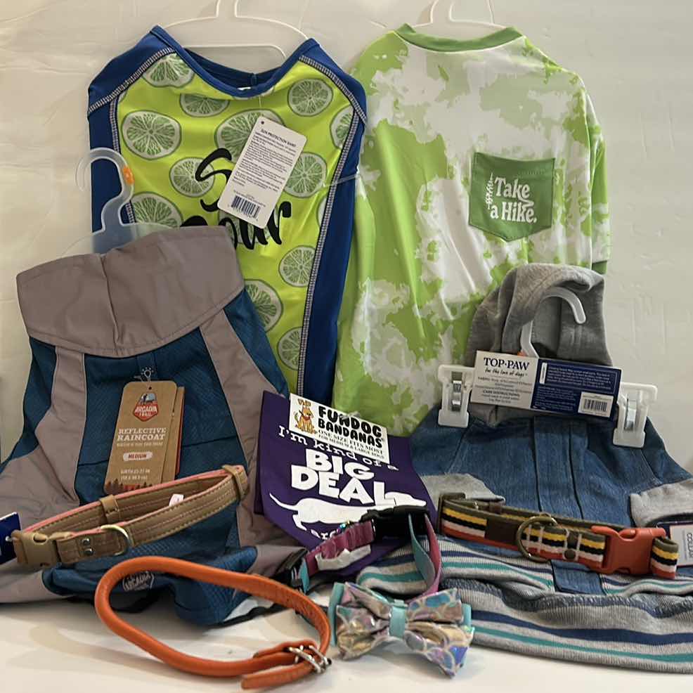 Photo 1 of NEW MEDIUM DOG ASSORTMENT - 2 TEES, 1 REFLECTIVE JACKET, 1 DENIM WITH HOODIE, 1 BANDANA AND 4 COLLARS