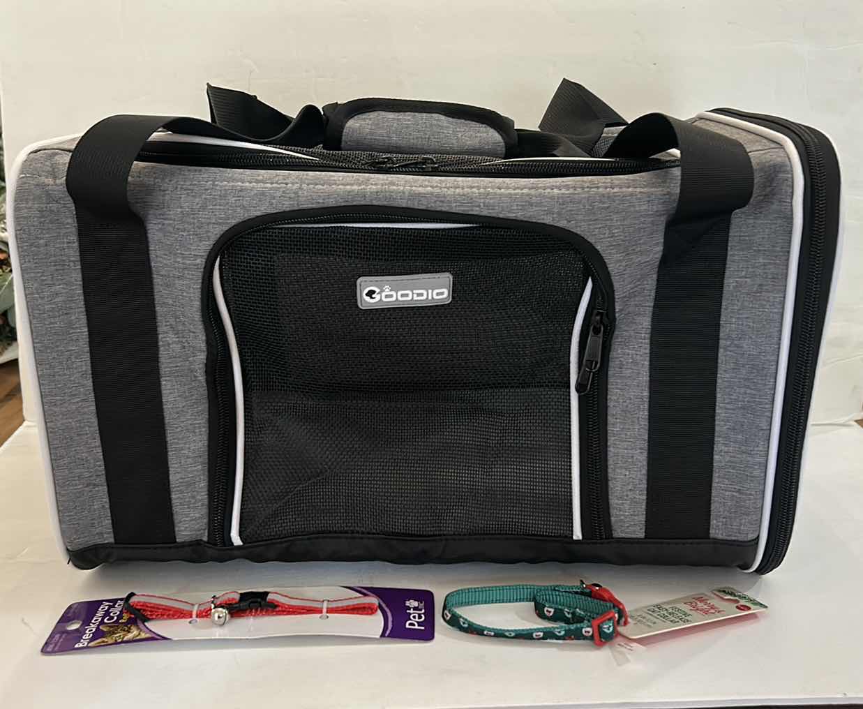 Photo 1 of NEW PET ASSORTMENT- 1 GOODIO CAT/PET CARRIER AND 2 COLLARS