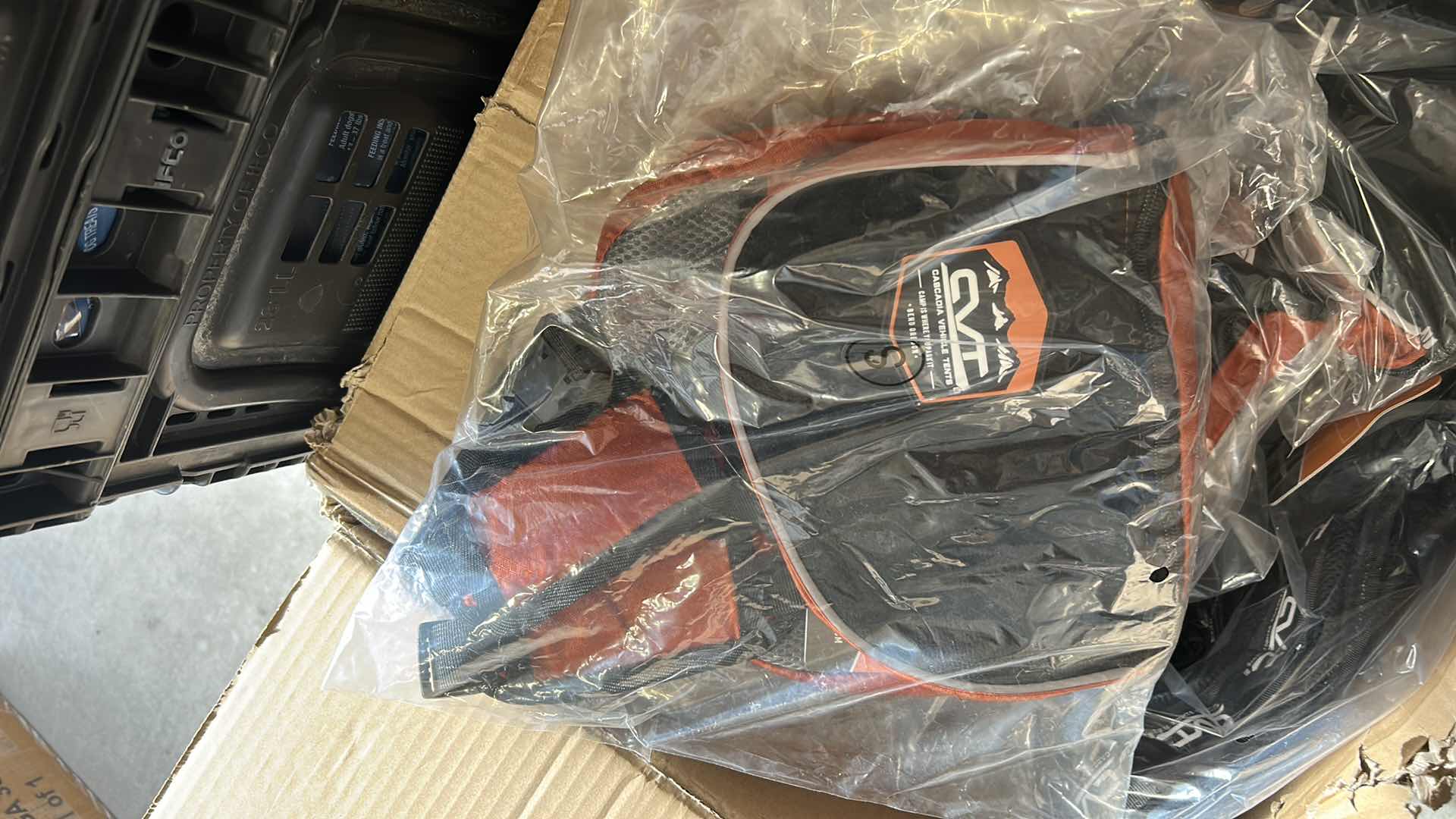 Photo 1 of LARGE BOX OF NEW DOG HARNESSES, SADDLEBAGS AND MORE