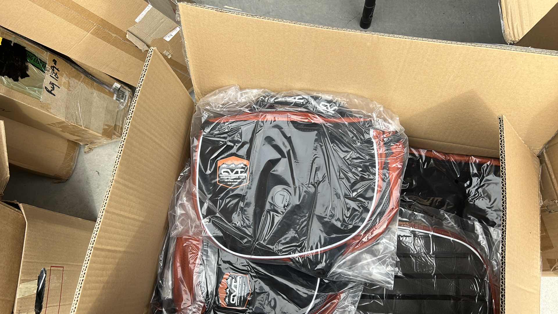 Photo 1 of LARGE BOX FULL OF NEW DOG HARNESSES AND SADDLEBAGS 